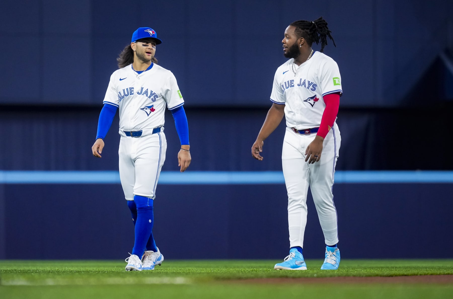 TORONTO, ON - APRIL 10: Bo Bichette #11 and Vladimir Guerrero Jr. #27 of Toronto Blue Jays warm up on the field ahead of playing the Seattle Mariners in their MLB game at the Rogers Centre on April 10, 2024 in Toronto, Ontario, Canada. (Photo by Mark Blinch/Getty Images)