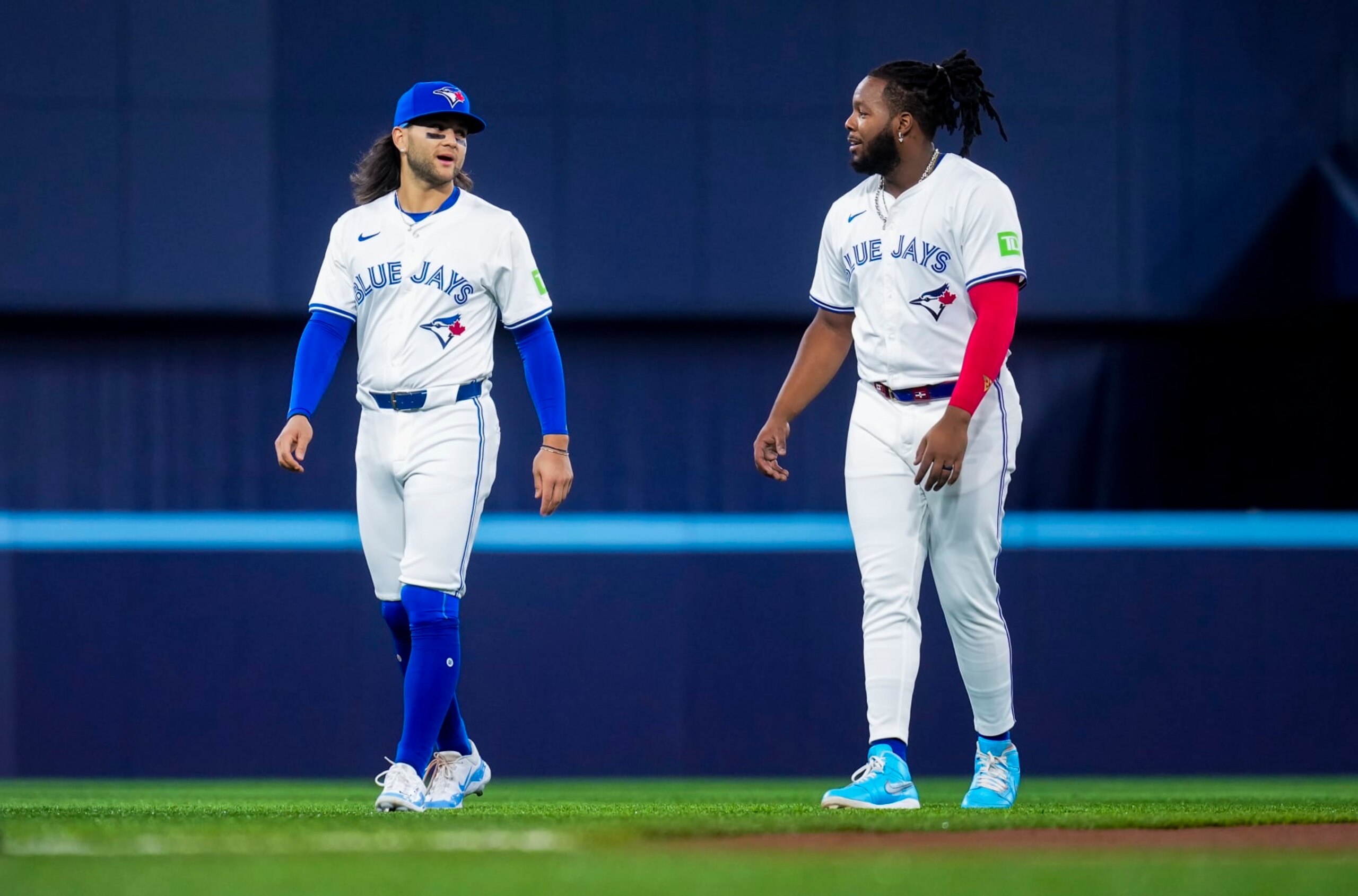 TORONTO, ON - APRIL 10: Bo Bichette #11 and Vladimir Guerrero Jr. #27 of Toronto Blue Jays warm up on the field ahead of playing the Seattle Mariners in their MLB game at the Rogers Centre on April 10, 2024 in Toronto, Ontario, Canada. (Photo by Mark Blinch/Getty Images)
