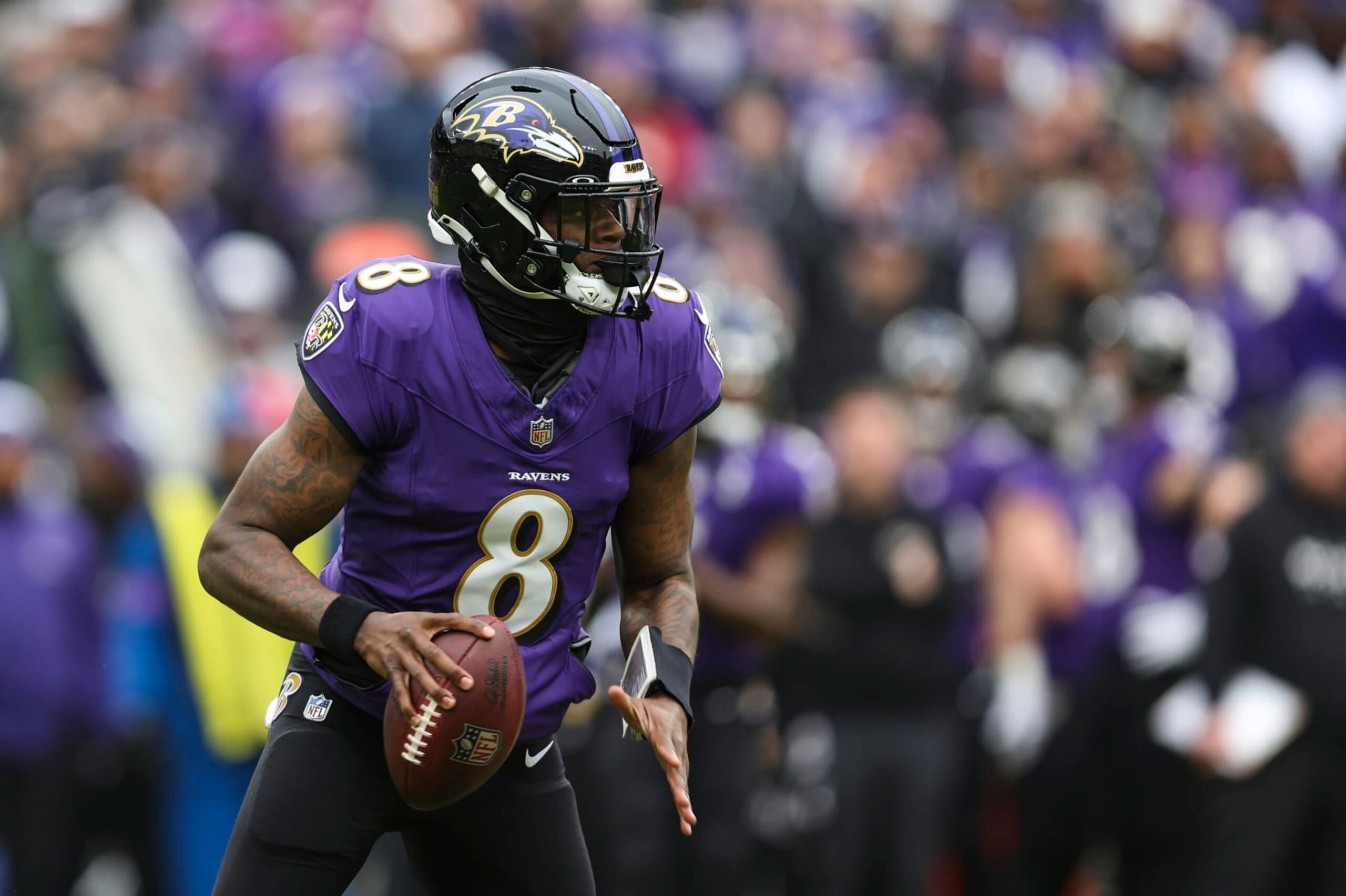 BALTIMORE, MD - JANUARY 28: Lamar Jackson #8 of the Baltimore Ravens drops back to pass during the AFC Championship NFL football game against the Kansas City Chiefs at M&T Bank Stadium on January 28, 2024 in Baltimore, Maryland. (Photo by Perry Knotts/Getty Images)