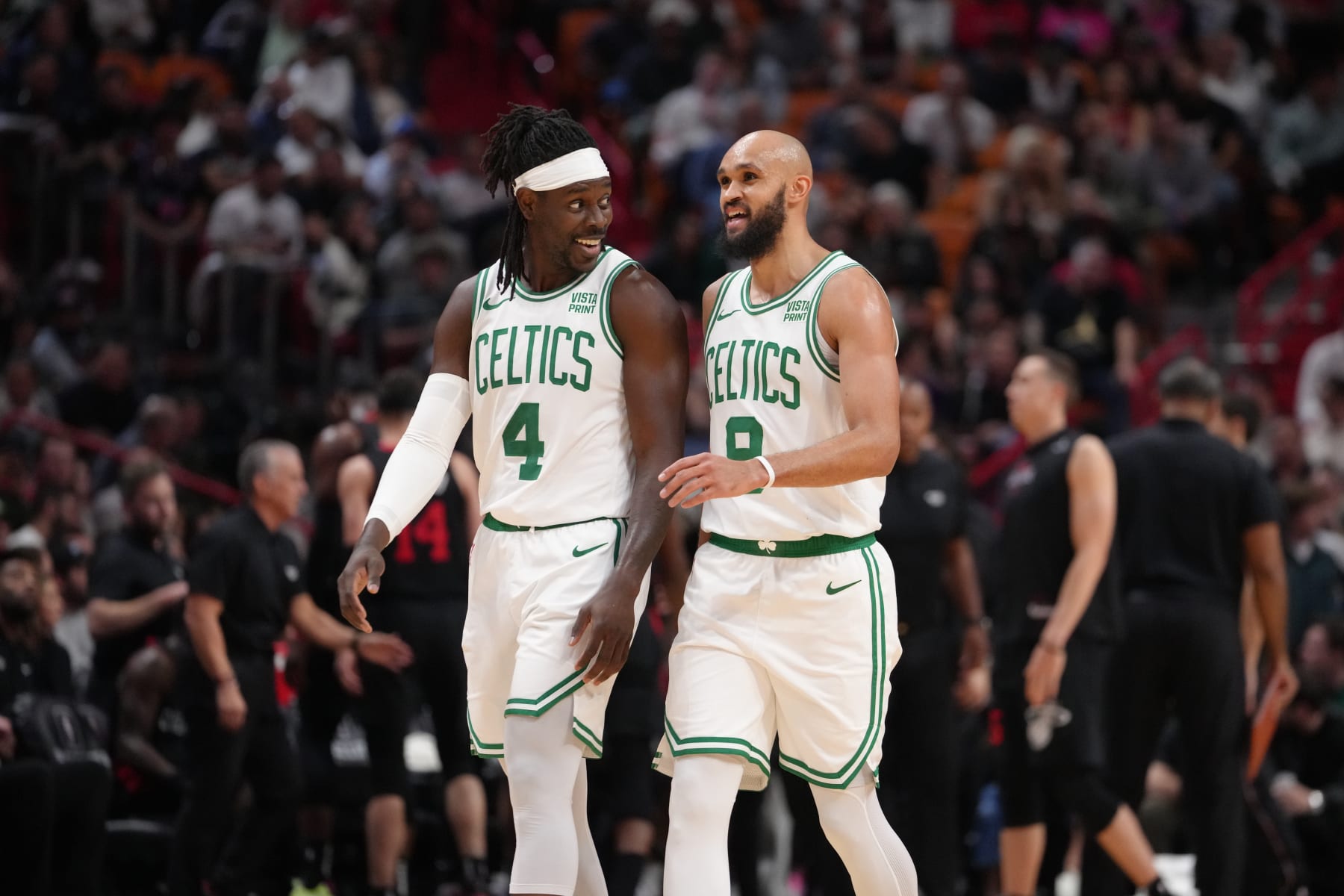 MIAMI, FL - JANUARY 25: Jrue Holiday #4 talks to Derrick White #9 of the Boston Celtics during the game against the Miami Heat on January 25, 2024 at Kaseya Center in Miami, Florida. NOTE TO USER: User expressly acknowledges and agrees that, by downloading and or using this Photograph, user is consenting to the terms and conditions of the Getty Images License Agreement. Mandatory Copyright Notice: Copyright 2024 NBAE (Photo by Eric Espada/NBAE via Getty Images)