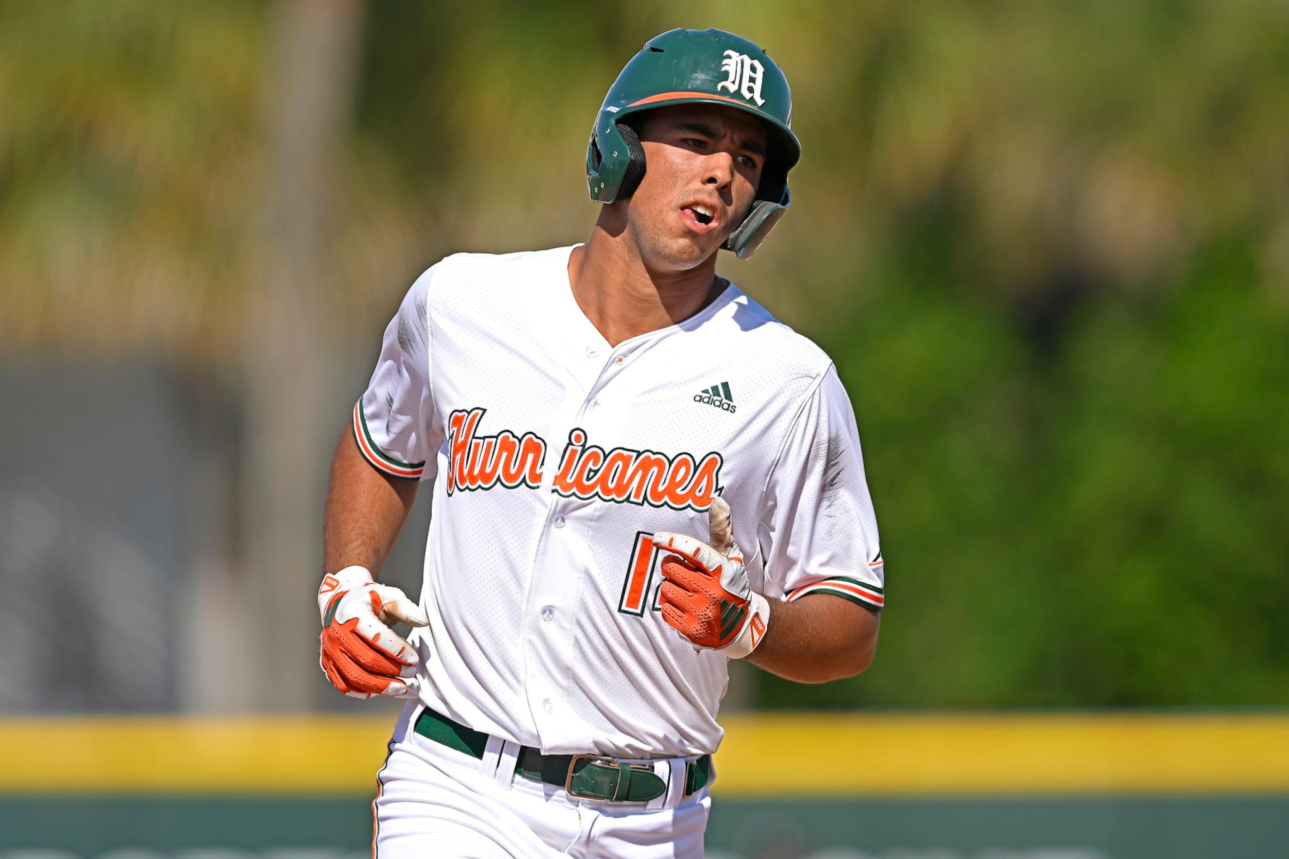 CORAL GABLES, FL - APRIL 21: Miami infielder Daniel Cuvet (14) rounds the bases after hitting a three-run home run in the sixth inning as the Miami Hurricanes faced the Louisville Cardinals on April 21, 2024, at Mark Light Field at Alex Rodriguez Park in Coral Gables, Florida. (Photo by Samuel Lewis/Icon Sportswire via Getty Images)