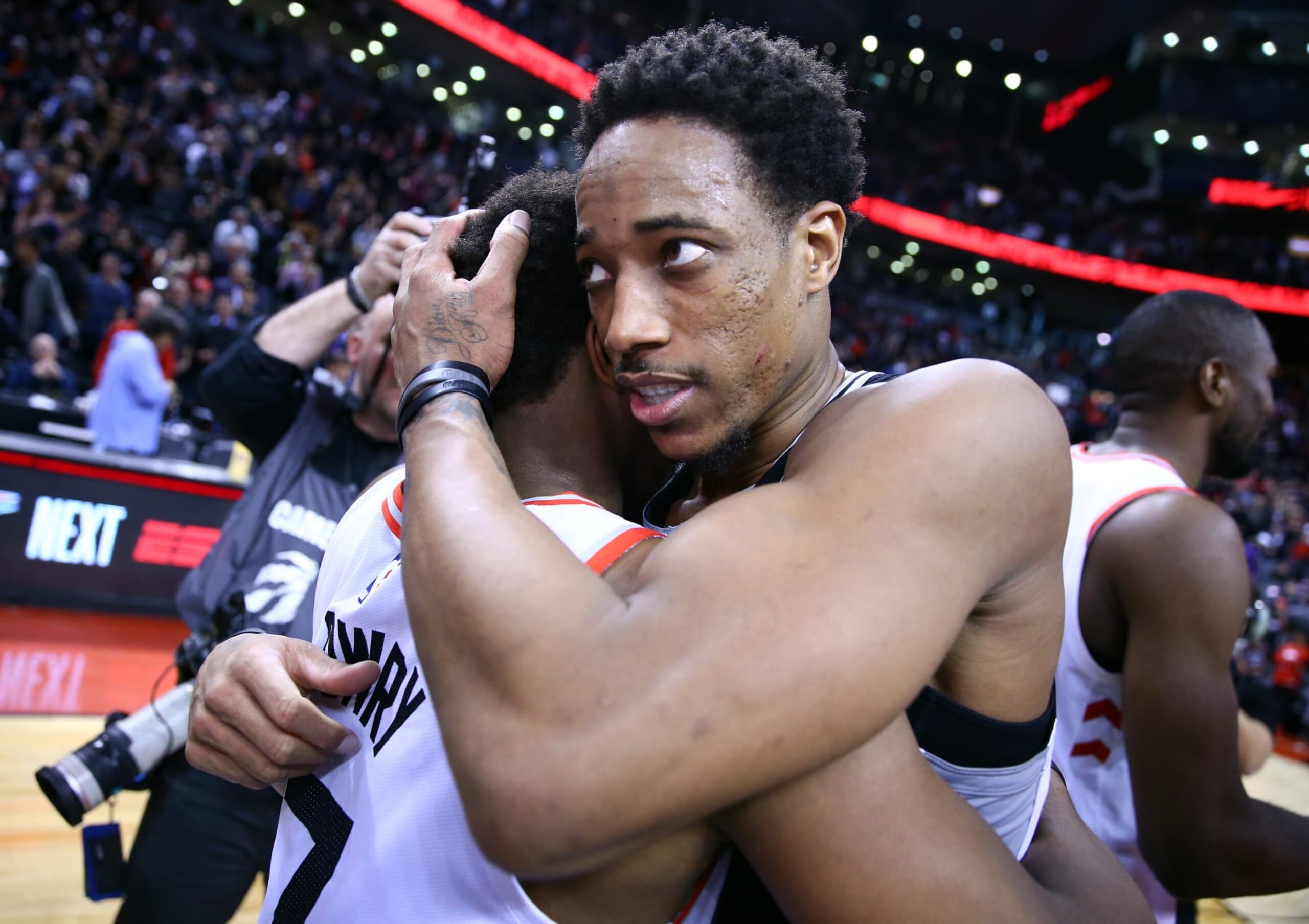 TORONTO, ON - FEBRUARY 22:  DeMar DeRozan #10 of the San Antonio Spurs hugs Kyle Lowry #7 of the Toronto Raptors following an NBA game at Scotiabank Arena on February 22, 2019 in Toronto, Canada.  NOTE TO USER: User expressly acknowledges and agrees that, by downloading and or using this photograph, User is consenting to the terms and conditions of the Getty Images License Agreement.  (Photo by Vaughn Ridley/Getty Images)