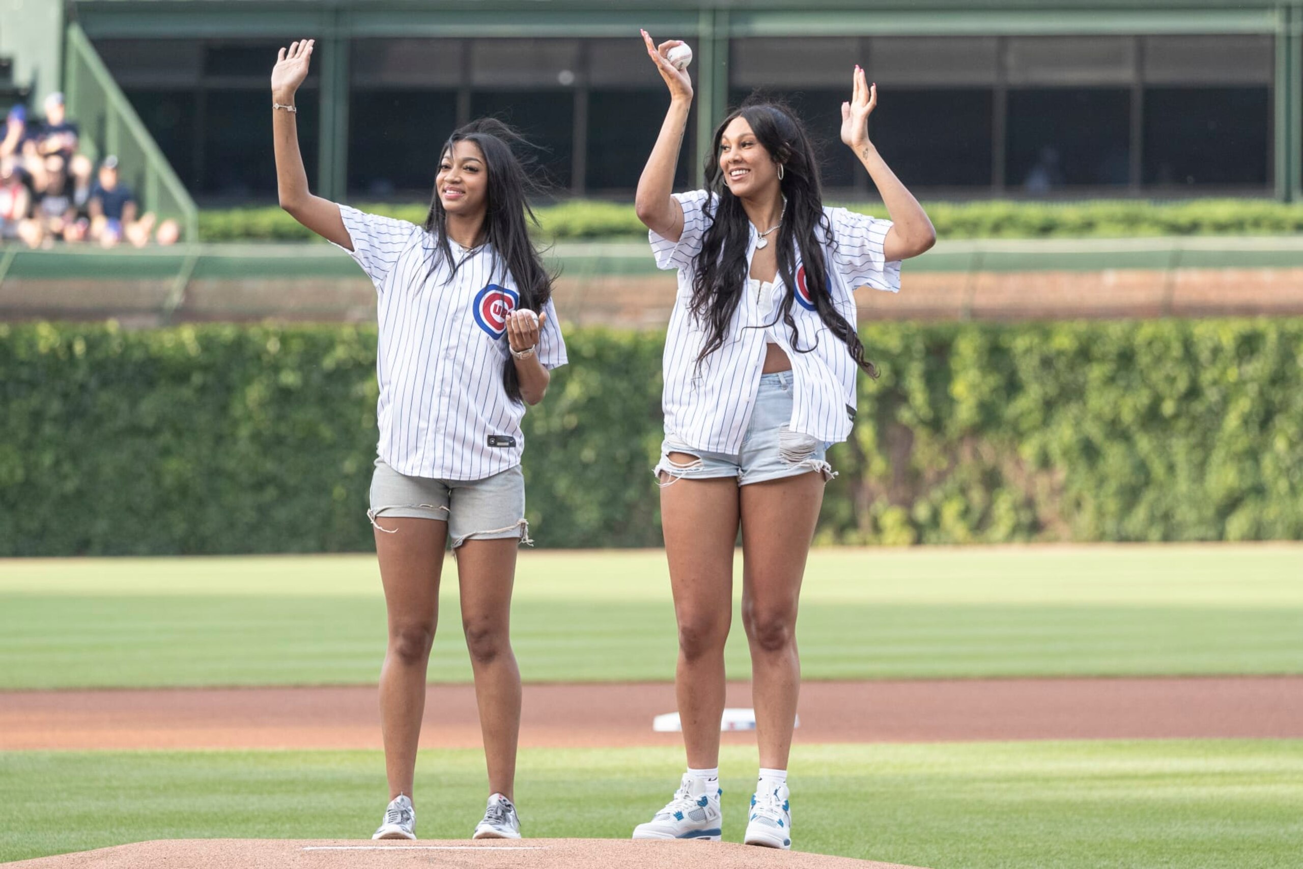 CHICAGO, ILLINOIS - MAY 21: Angel Reese and Kamilla Cardoso of the Chicago Sky throw out a ceremonial first pitch before a game between the Atlanta Braves and Chicago Cubs at Wrigley Field on May 21, 2024 in Chicago, Illinois. (Photo by Griffin Quinn/Getty Images) CHICAGO, ILLINOIS - MAY 21: Angel Reese and Kamilla Cardoso of the Chicago Sky throw out a ceremonial first pitch before a game between the Atlanta Braves and Chicago Cubs at Wrigley Field on May 21, 2024 in Chicago, Illinois. (Photo by Griffin Quinn/Getty Images)