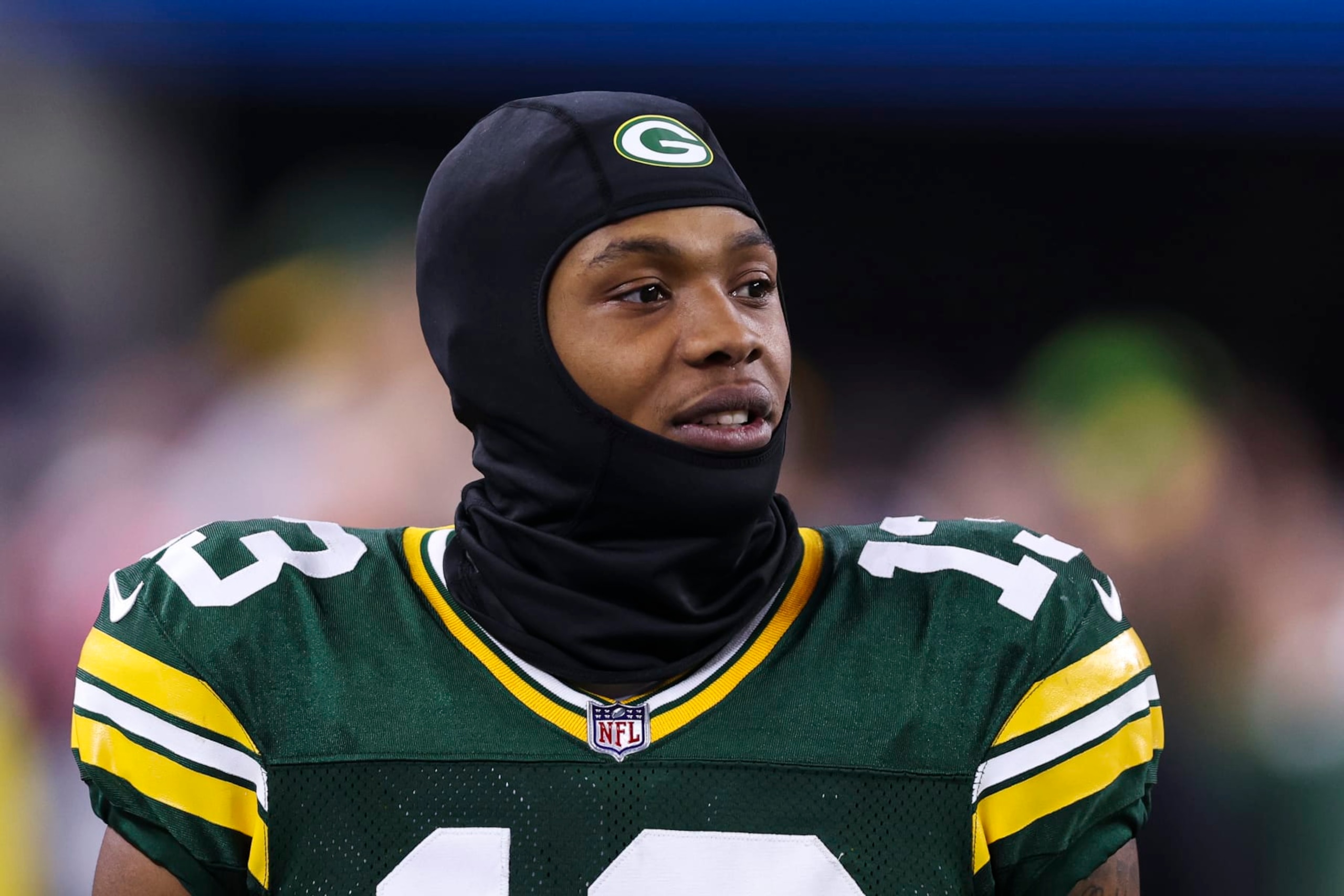 ARLINGTON, TX - JANUARY 14: Dontayvion Wicks #13 of the Green Bay Packers looks on from the sideline during an NFL wild-card playoff football game against the Dallas Cowboys at AT&T Stadium on January 14, 2024 in Arlington, Texas. (Photo by Perry Knotts/Getty Images)