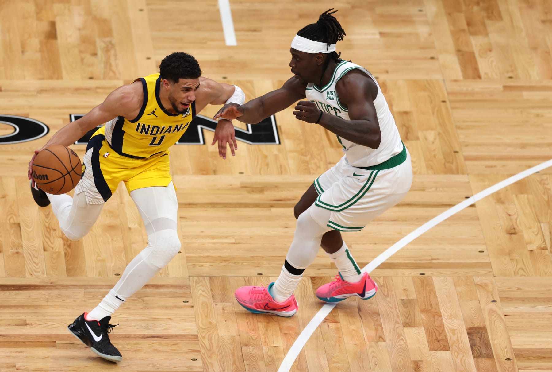 BOSTON, MASSACHUSETTS - MAY 21: Tyrese Haliburton #0 of the Indiana Pacers drives the ball against Jrue Holiday #4 of the Boston Celtics during the second quarter in Game One of the Eastern Conference Finals at TD Garden on May 21, 2024 in Boston, Massachusetts. NOTE TO USER: User expressly acknowledges and agrees that, by downloading and or using this photograph, User is consenting to the terms and conditions of the Getty Images License Agreement. (Photo by Adam Glanzman/Getty Images)