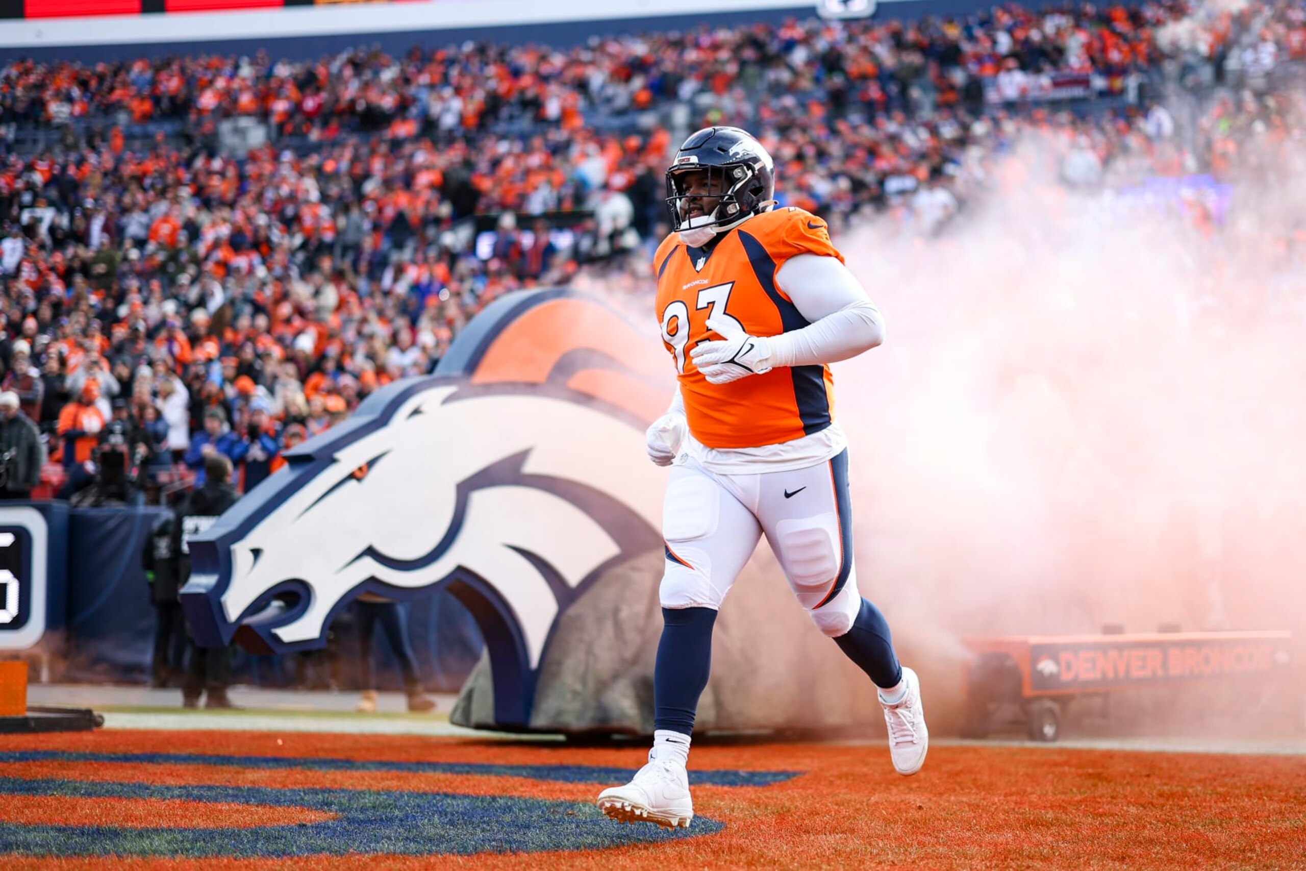 DENVER, CO - DECEMBER 31: D.J. Jones #93 of the Denver Broncos runs out of the tunnel prior to an NFL football game against the Los Angeles Chargers at Empower Field at Mile High on December 31, 2023 in Denver, Colorado. (Photo by Perry Knotts/Getty Images)