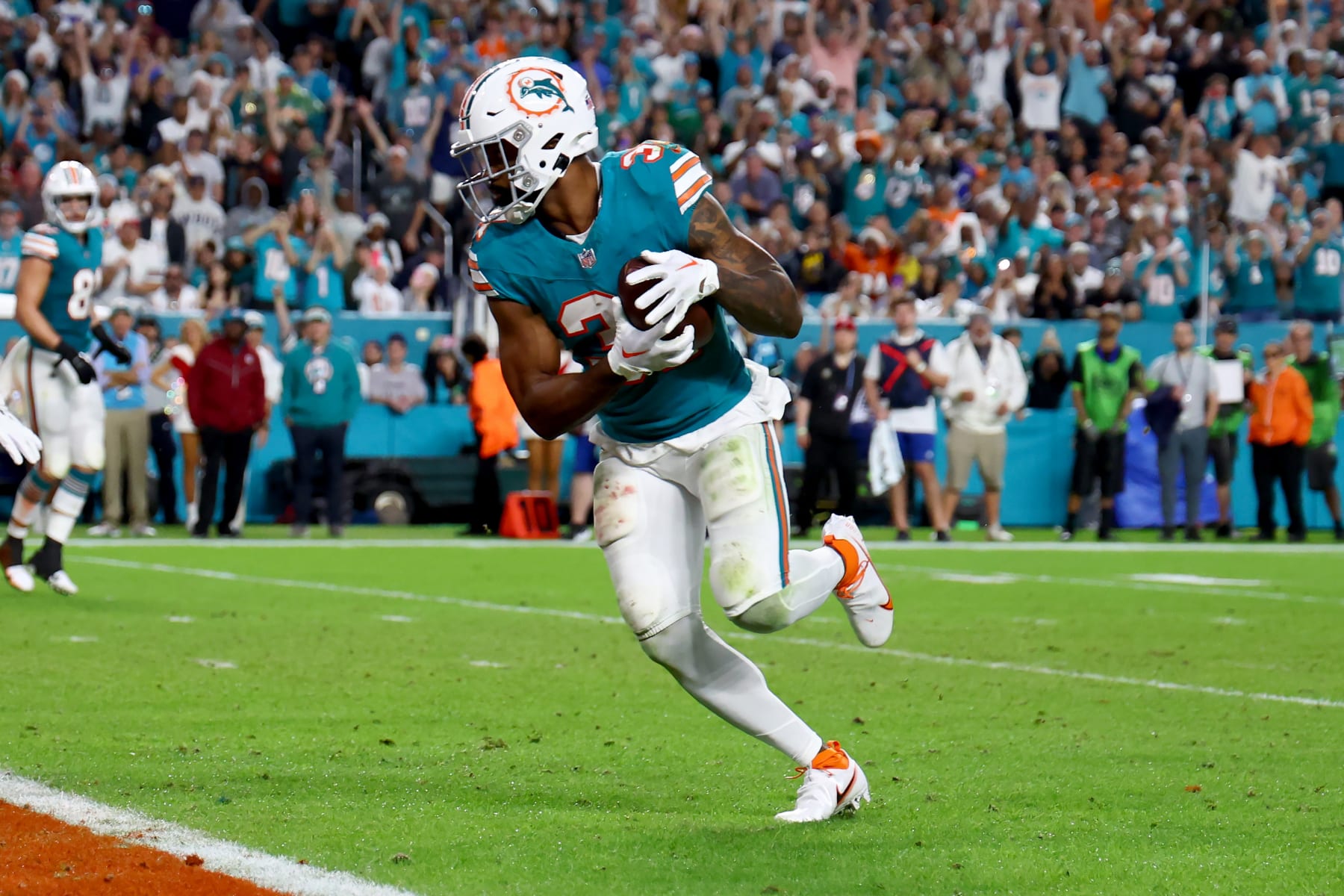 MIAMI GARDENS, FLORIDA - DECEMBER 24: Raheem Mostert #31 of the Miami Dolphins runs the ball for a touchdown during the second quarter in the game against the Dallas Cowboys at Hard Rock Stadium on December 24, 2023 in Miami Gardens, Florida. (Photo by Megan Briggs/Getty Images)