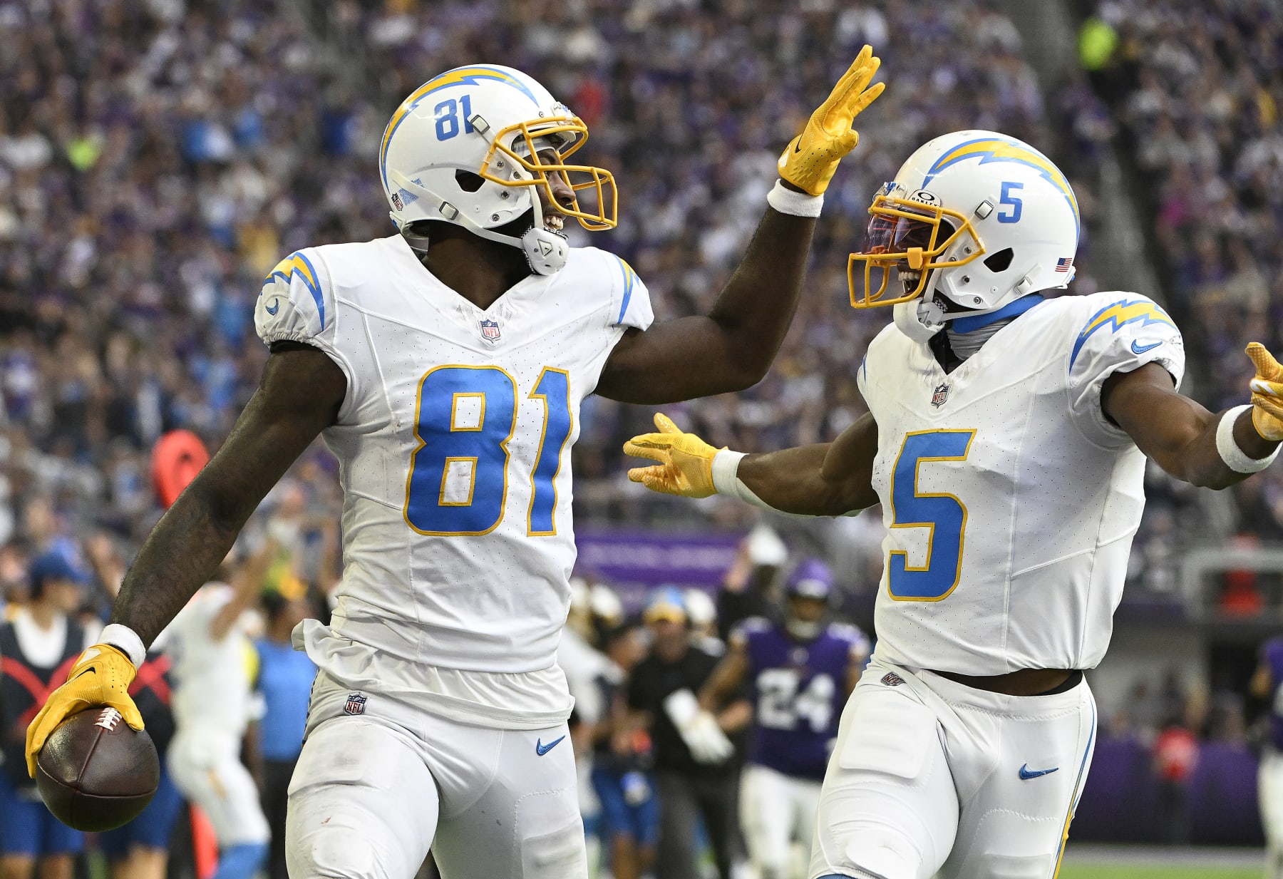 MINNEAPOLIS, MINNESOTA - SEPTEMBER 24: Mike Williams #81 of the Los Angeles Chargers and Joshua Palmer #5 of the Los Angeles Chargers celebrate after William's receiving touchdown during the third quarter against the Minnesota Vikings at U.S. Bank Stadium on September 24, 2023 in Minneapolis, Minnesota. (Photo by Stephen Maturen/Getty Images)