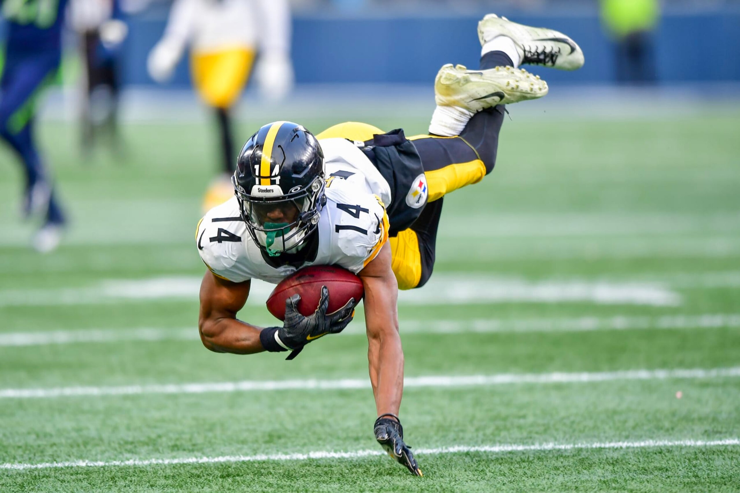 SEATTLE, WASHINGTON - DECEMBER 31: George Pickens #14 of the Pittsburgh Steelers reacts after catching a pass for a first down during the fourth quarter against the Seattle Seahawks at Lumen Field on December 31, 2023 in Seattle, Washington. (Photo by Jane Gershovich/Getty Images)