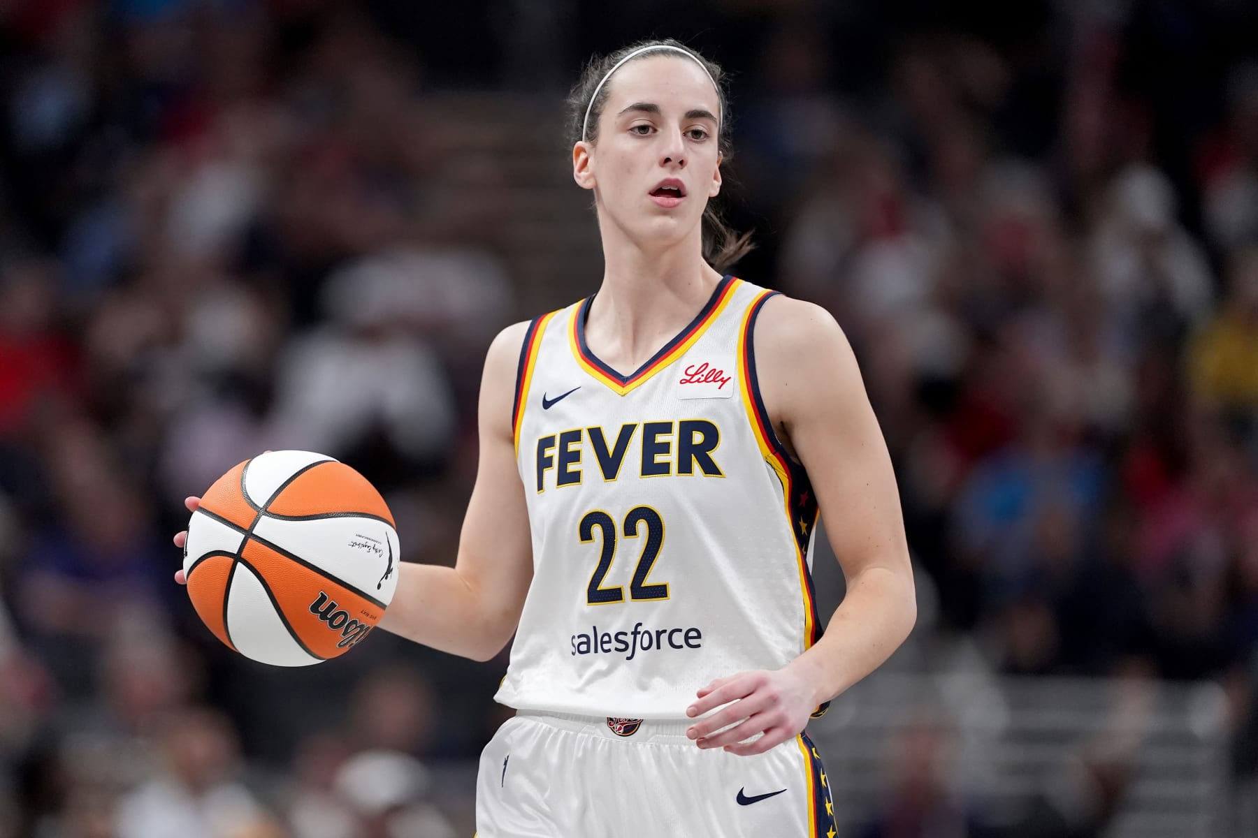 INDIANAPOLIS, INDIANA - MAY 20: Caitlin Clark #22 of the Indiana Fever dribbles the ball during the third quarter in the game at Gainbridge Fieldhouse on May 20, 2024 in Indianapolis, Indiana. NOTE TO USER: User expressly acknowledges and agrees that, by downloading and or using this photograph, User is consenting to the terms and conditions of the Getty Images License Agreement. (Photo by Emilee Chinn/Getty Images) INDIANAPOLIS, INDIANA - MAY 20: Caitlin Clark #22 of the Indiana Fever dribbles the ball during the third quarter in the game at Gainbridge Fieldhouse on May 20, 2024 in Indianapolis, Indiana. NOTE TO USER: User expressly acknowledges and agrees that, by downloading and or using this photograph, User is consenting to the terms and conditions of the Getty Images License Agreement. (Photo by Emilee Chinn/Getty Images)