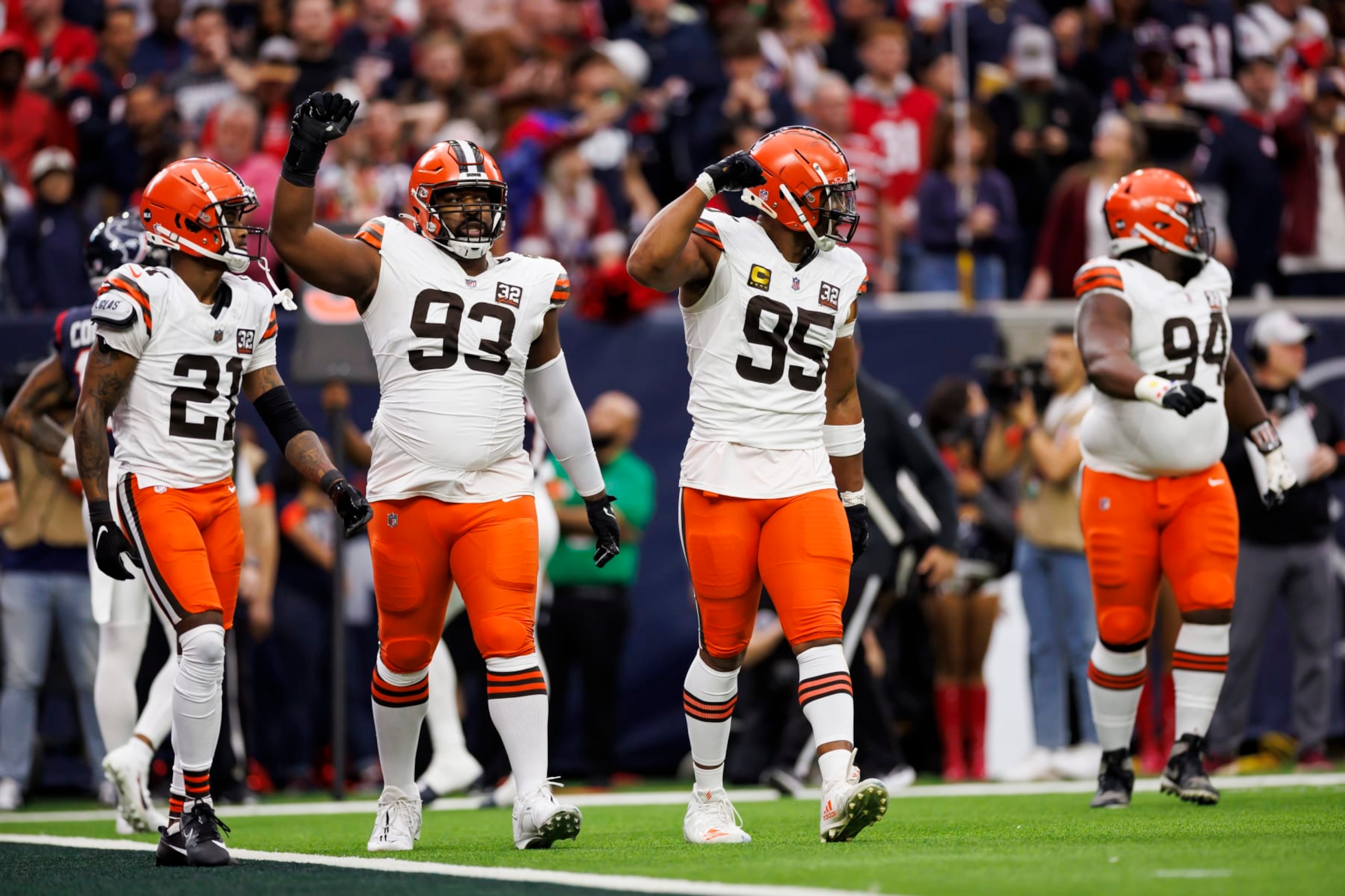 Shelby Harris (93) and Myles Garrett (95)