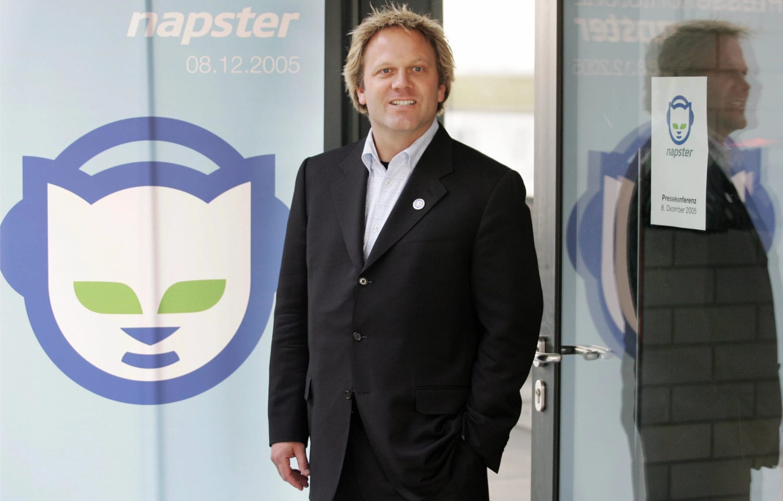 FRANKFURT/MAIN, Germany:  Napster President Bradford Duea stands beside his company's logo 08 December 2005 before giving a press conference in Frankfurt/M. The online music swap company started its online services in Germany.    AFP PHOTO    DDP/THOMAS LOHNES GERMANY OUT  (Photo credit should read THOMAS LOHNES/DDP/AFP via Getty Images)