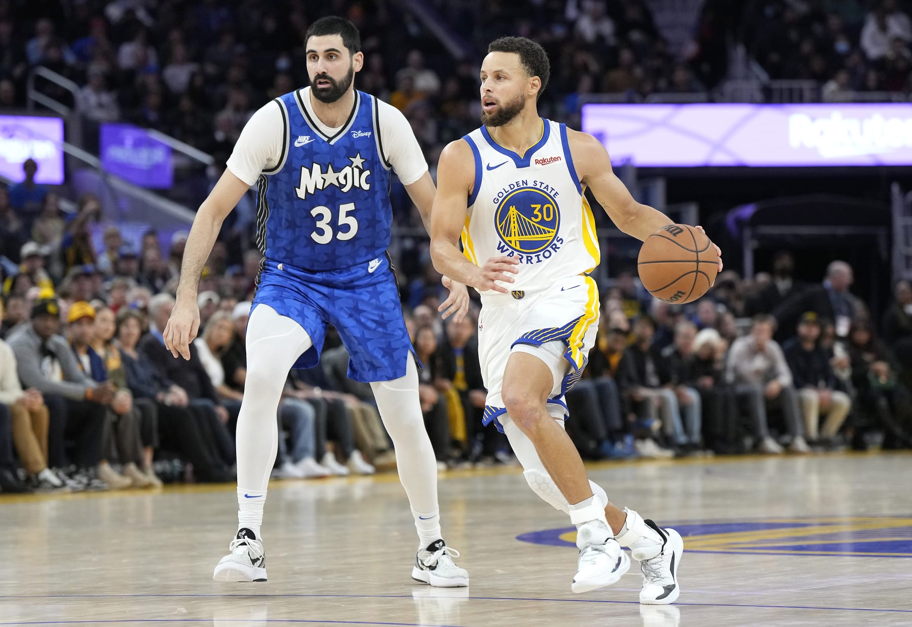 SAN FRANCISCO, CALIFORNIA - JANUARY 02: Stephen Curry #30 of the Golden State Warriors drives towards the basket past Goga Bitadze #35 of the Orlando Magic during the fourth quarter of an NBA basketball game at Chase Center on January 02, 2024 in San Francisco, California. NOTE TO USER: User expressly acknowledges and agrees that, by downloading and or using this photograph, User is consenting to the terms and conditions of the Getty Images License Agreement. (Photo by Thearon W. Henderson/Getty Images)