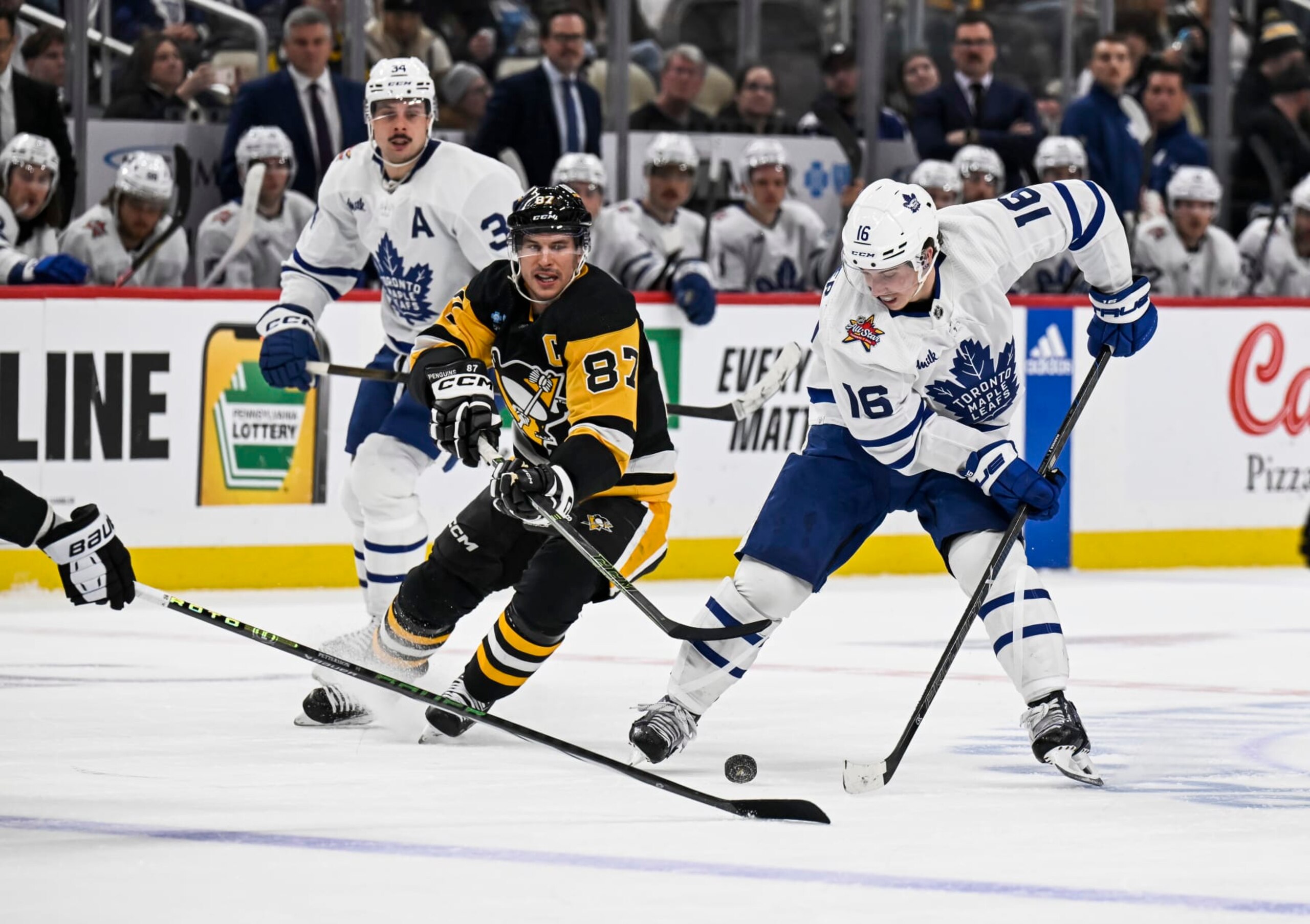 Pittsburgh Penguins captain Sidney Crosby  (87) chases Toronto Maple Leafs winger Mitch Marner. 