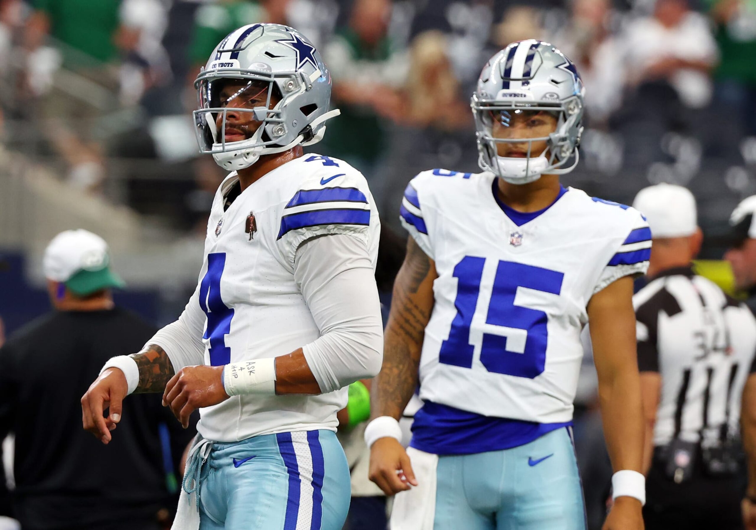 ARLINGTON, TEXAS - SEPTEMBER 17: Dak Prescott #4 of the Dallas Cowboys warms up as Trey Lance #15 of the Dallas Cowboys looks on before the game against the New York Jets at AT&T Stadium on September 17, 2023 in Arlington, Texas. (Photo by Richard Rodriguez/Getty Images)