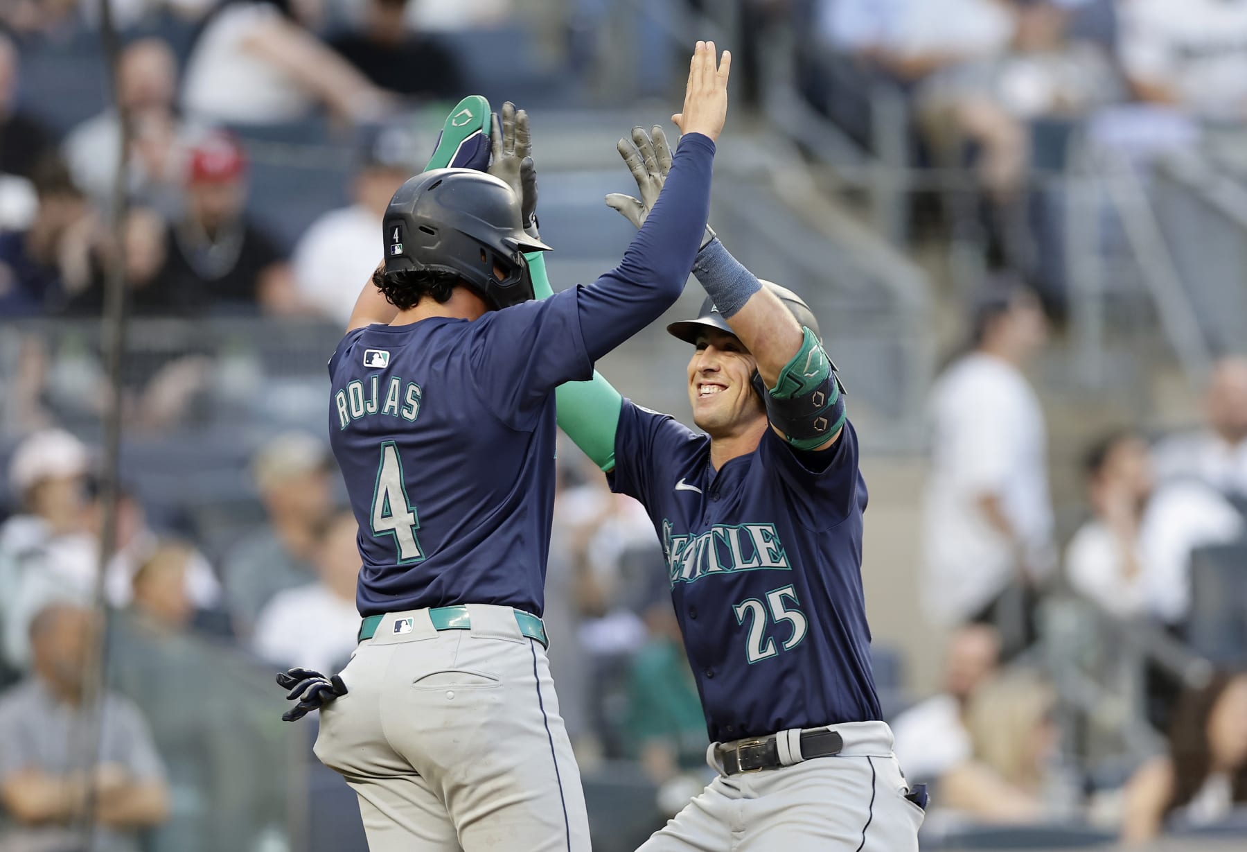 NEW YORK, NEW YORK - MAY 21:  Dylan Moore #25 of the Seattle Mariners celebrates his third inning two run home run against the New York Yankees with teammate Josh Rojas #4 at Yankee Stadium on May 21, 2024 in New York City. (Photo by Jim McIsaac/Getty Images)
