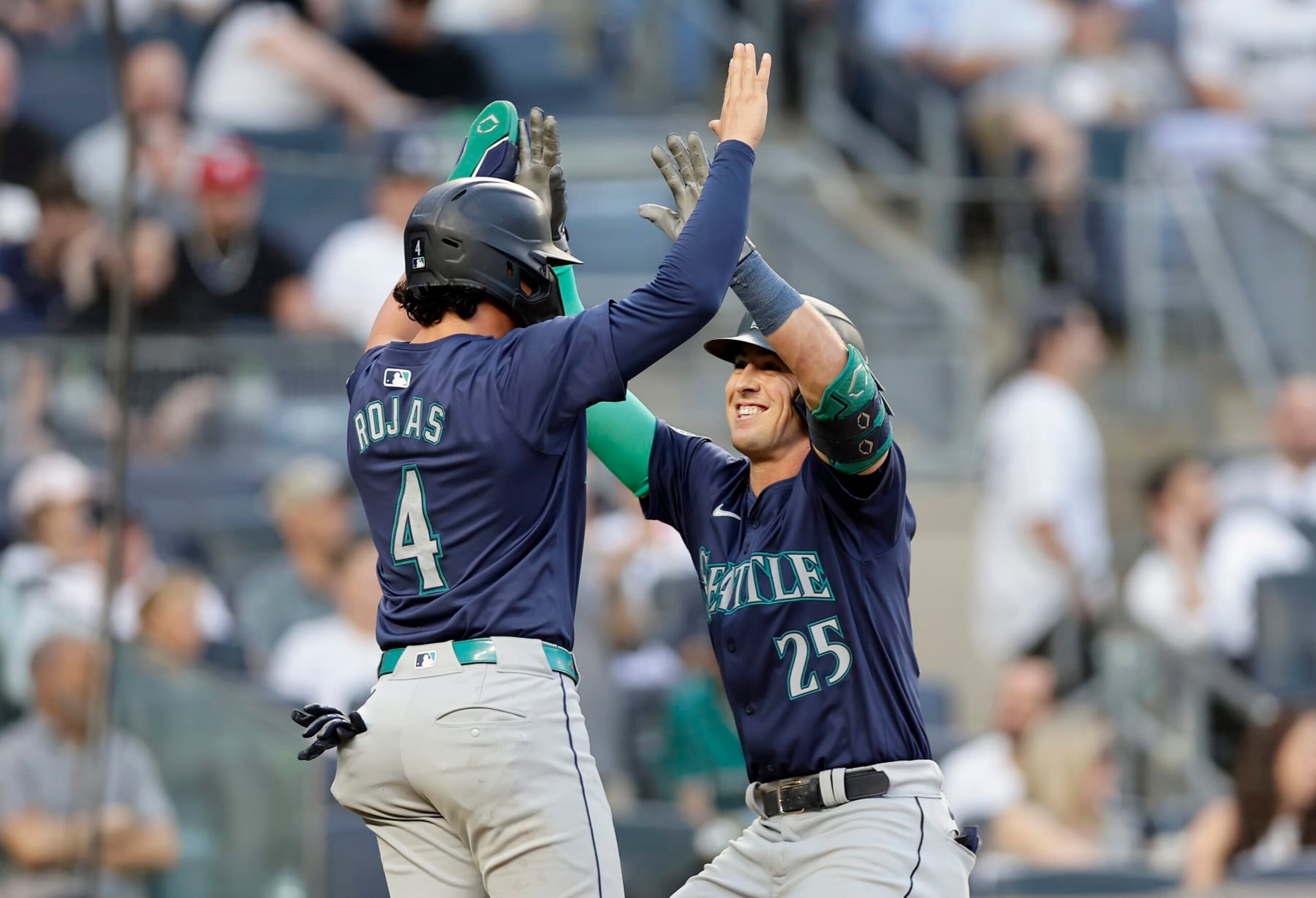 NEW YORK, NEW YORK - MAY 21:  Dylan Moore #25 of the Seattle Mariners celebrates his third inning two run home run against the New York Yankees with teammate Josh Rojas #4 at Yankee Stadium on May 21, 2024 in New York City. (Photo by Jim McIsaac/Getty Images)