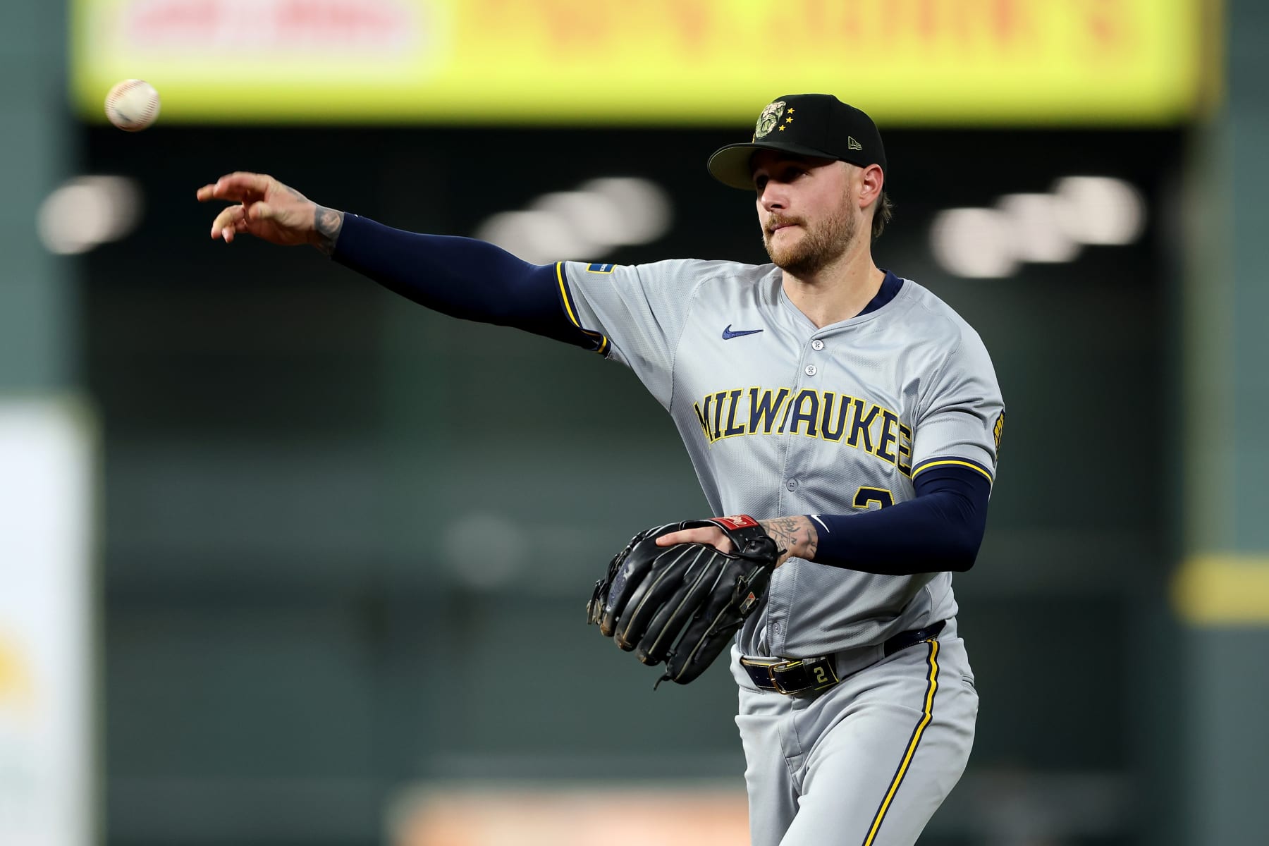 HOUSTON, TEXAS - MAY 18: Brice Turang #2 of the Milwaukee Brewers throws to first for an out in the fifth inning against the Houston Astros at Minute Maid Park on May 18, 2024 in Houston, Texas. (Photo by Tim Warner/Getty Images)