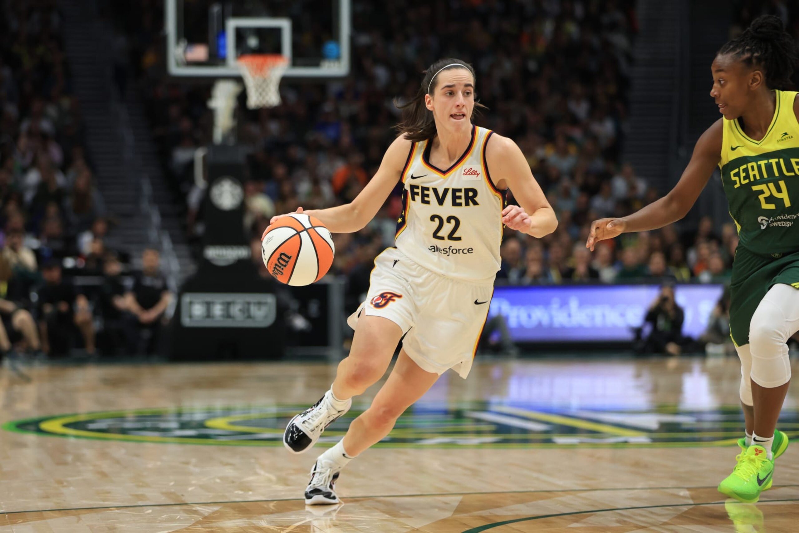 SEATTLE, WA - MAY 22: Caitlin Clark #22 of the Indiana Fever drives to the basket during the game  against the Seattle Storm on May 22, 2024 at Climate Pledge Arena in Seattle, Washington. NOTE TO USER: User expressly acknowledges and agrees that, by downloading and or using this photograph, User is consenting to the terms and conditions of the Getty Images License Agreement. Mandatory Copyright Notice: Copyright 2024 NBAE (Photo by Scott Eklund/NBAE via Getty Images)