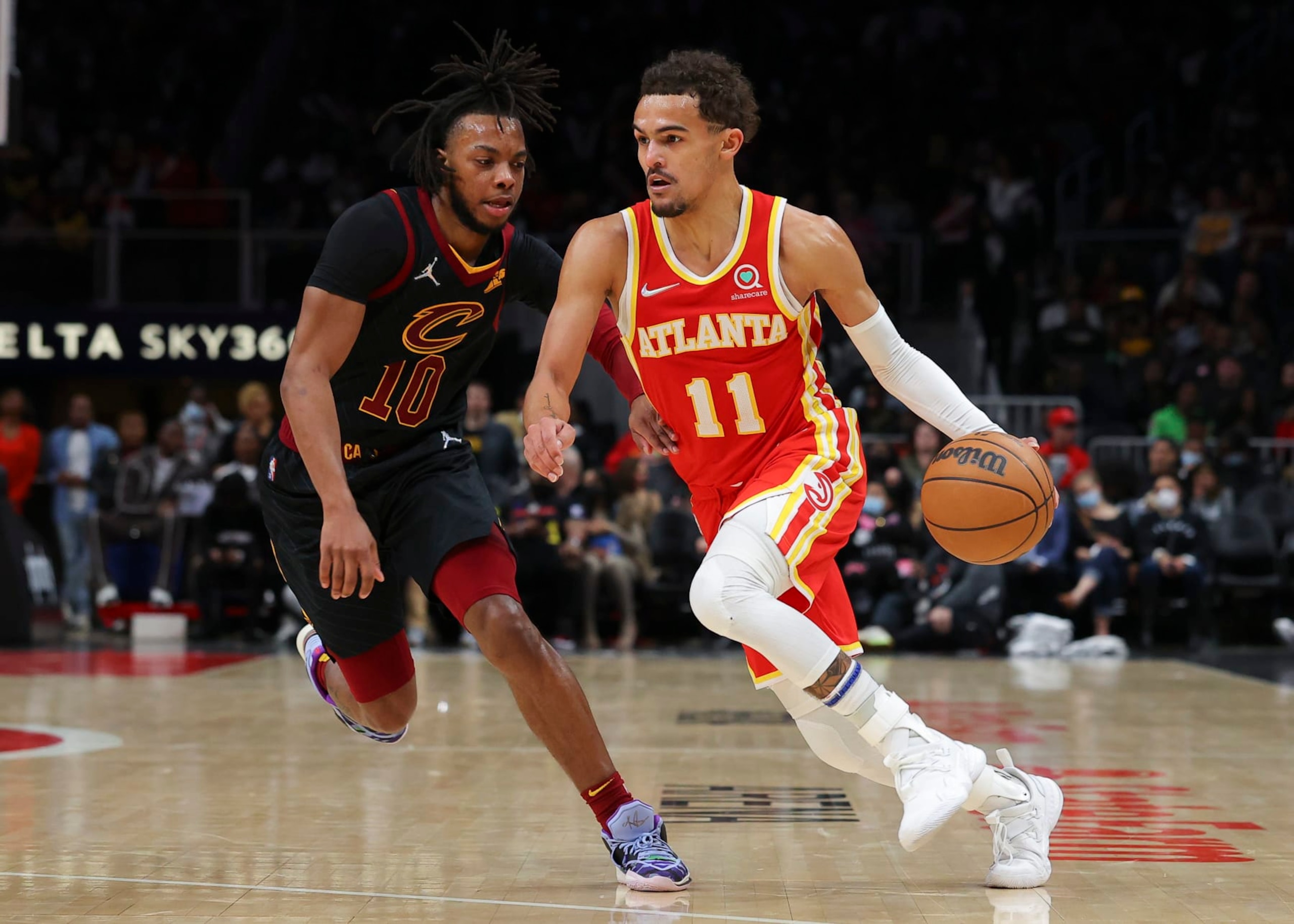 ATLANTA, GA - FEBRUARY 15: Trae Young #11 of the Atlanta Hawks drives to the basket against Darius Garland #10 of the Cleveland Cavaliers during the second half at State Farm Arena on February 15, 2022 in Atlanta, Georgia. NOTE TO USER: User expressly acknowledges and agrees that, by downloading and or using this photograph, User is consenting to the terms and conditions of the Getty Images License Agreement. (Photo by Todd Kirkland/Getty Images) ATLANTA, GA - FEBRUARY 15: Trae Young #11 of the Atlanta Hawks drives to the basket against Darius Garland #10 of the Cleveland Cavaliers during the second half at State Farm Arena on February 15, 2022 in Atlanta, Georgia. NOTE TO USER: User expressly acknowledges and agrees that, by downloading and or using this photograph, User is consenting to the terms and conditions of the Getty Images License Agreement. (Photo by Todd Kirkland/Getty Images)