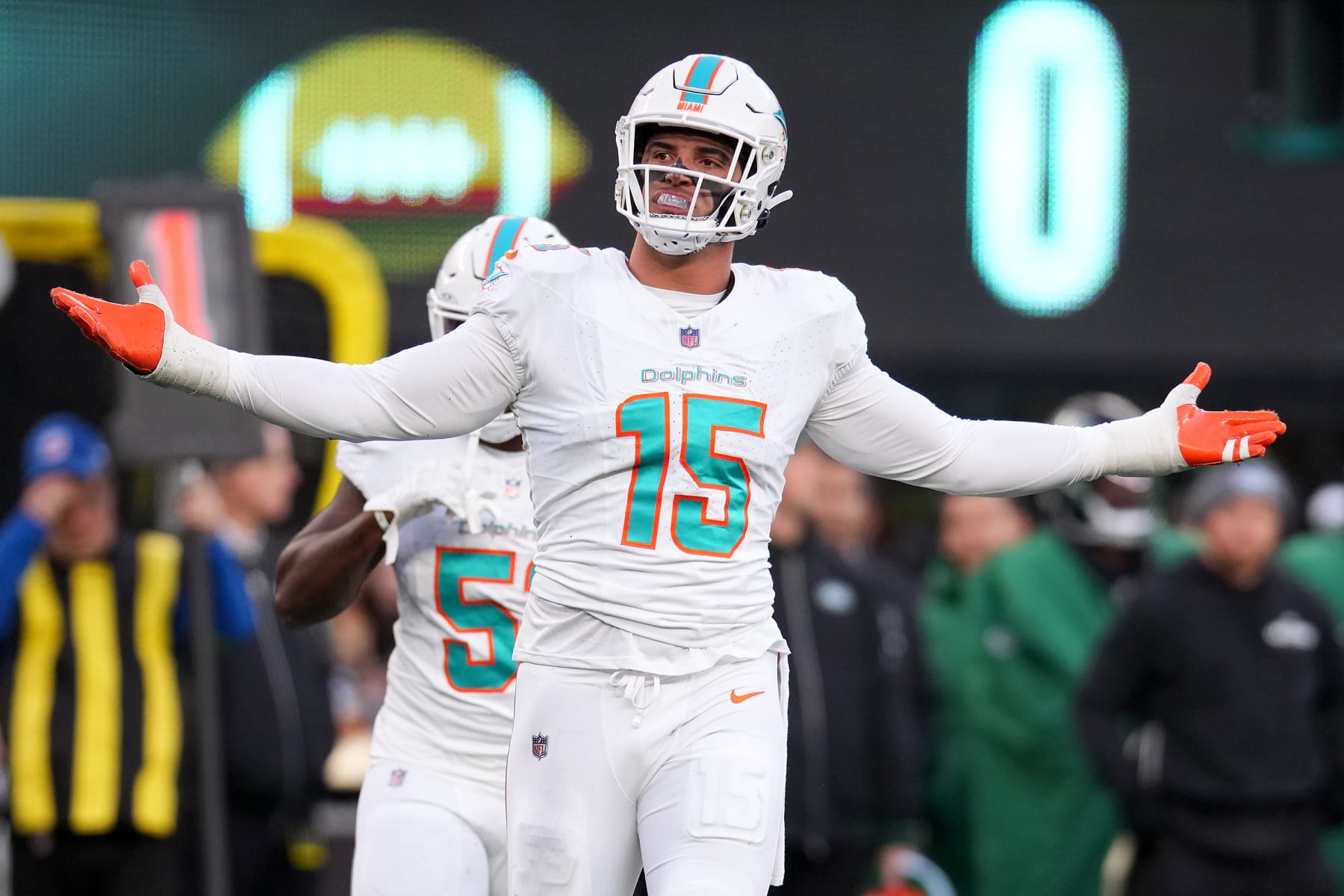 EAST RUTHERFORD, NEW JERSEY - NOVEMBER 24: Jaelan Phillips #15 of the Miami Dolphins celebrates after making a defensive stop against the New York Jets during the first quarter in the game at MetLife Stadium on November 24, 2023 in East Rutherford, New Jersey. (Photo by Mike Stobe/Getty Images)