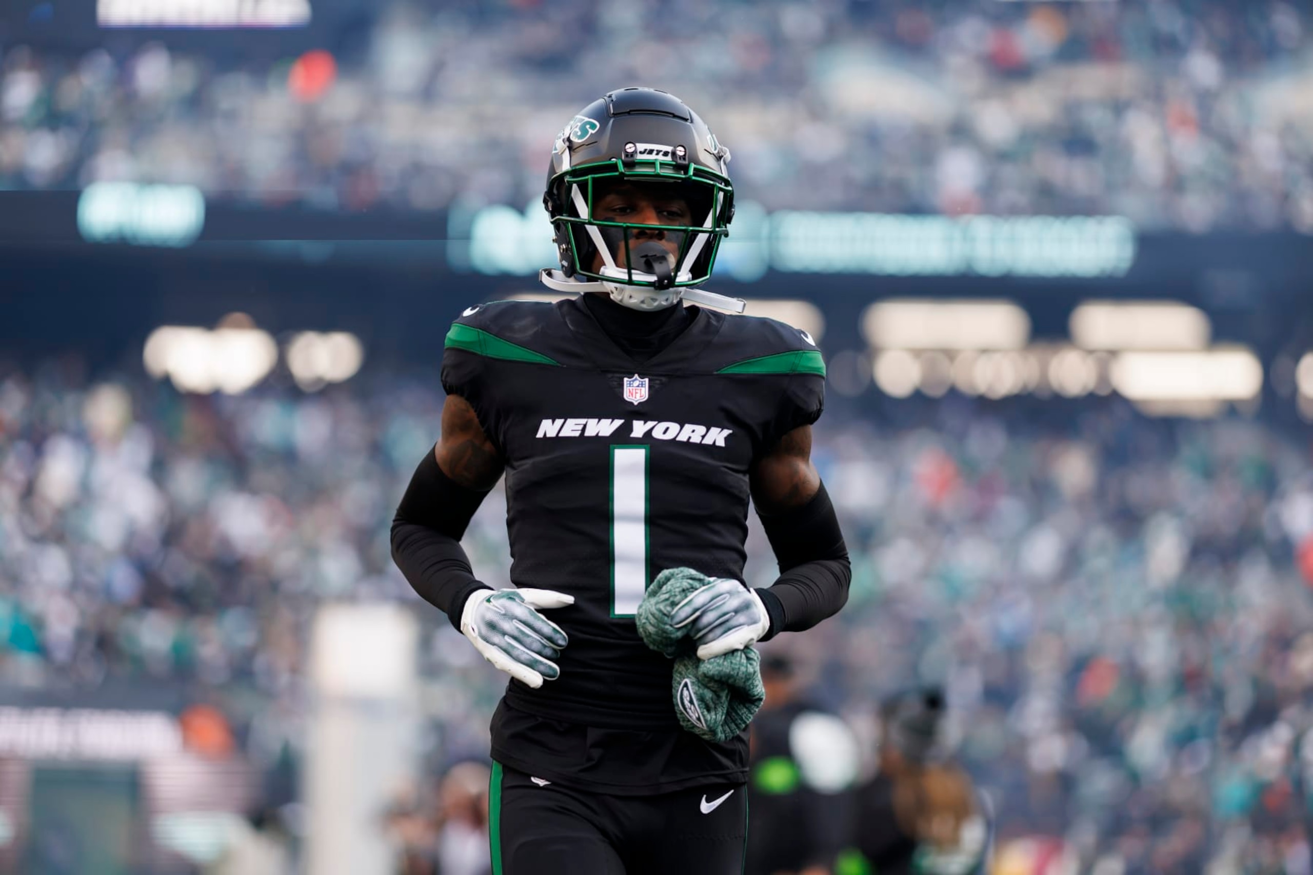 EAST RUTHERFORD, NEW JERSEY - NOVEMBER 24: Sauce Gardner #1 of the New York Jets runs onto the field during team entrances before an NFL football game against the Miami Dolphins at MetLife Stadium on November 24, 2023 in East Rutherford, New Jersey. (Photo by Ryan Kang/Getty Images)