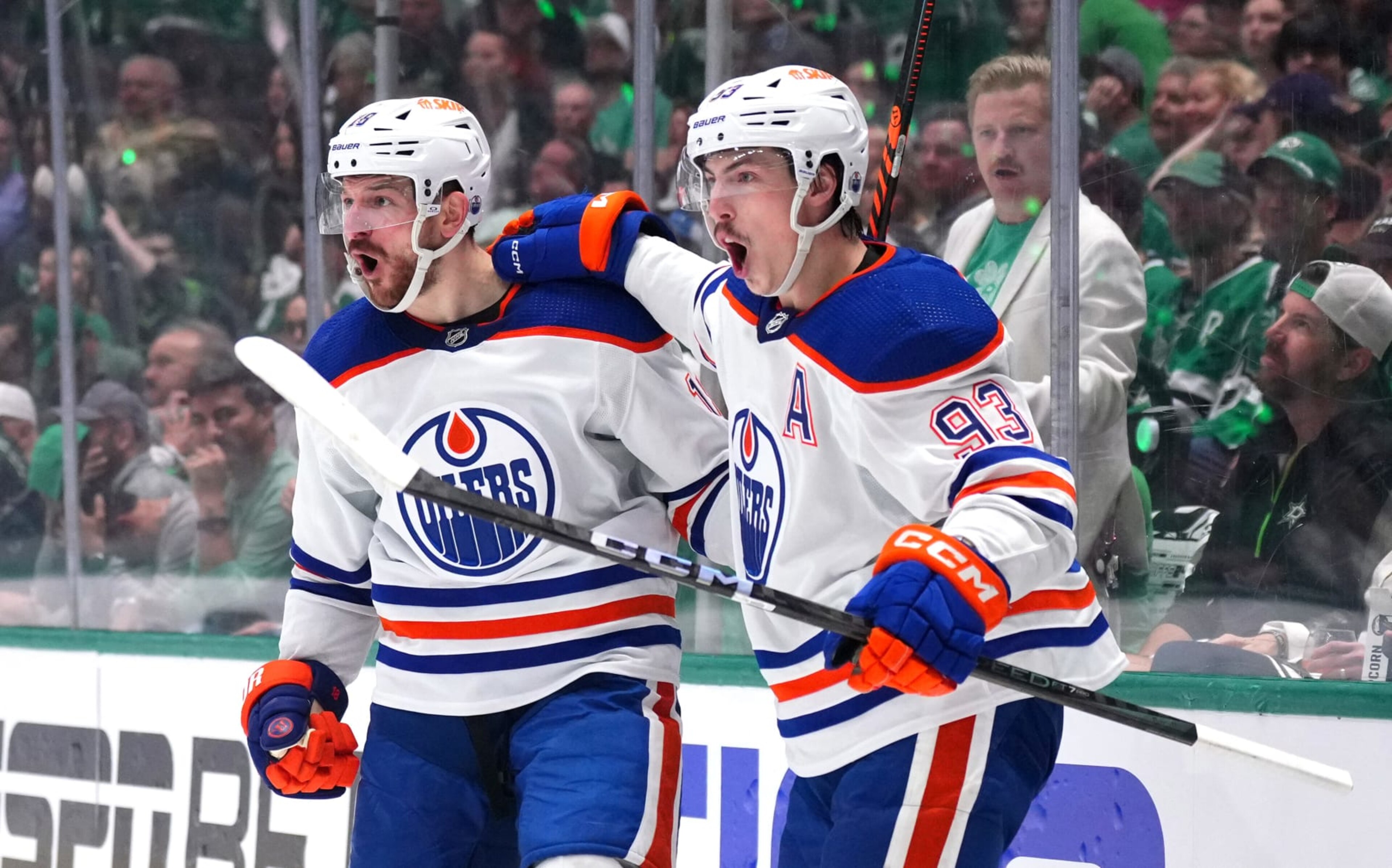 DALLAS, TEXAS - MAY 23: Zach Hyman #18 celebrates with Ryan Nugent-Hopkins #93 of the Edmonton Oilers after Hyman's goal against the Dallas Stars during the second period in Game One of the Western Conference Final of the 2024 Stanley Cup Playoffs at American Airlines Center on May 23, 2024 in Dallas, Texas. (Photo by Cooper Neill/Getty Images) DALLAS, TEXAS - MAY 23: Zach Hyman #18 celebrates with Ryan Nugent-Hopkins #93 of the Edmonton Oilers after Hyman's goal against the Dallas Stars during the second period in Game One of the Western Conference Final of the 2024 Stanley Cup Playoffs at American Airlines Center on May 23, 2024 in Dallas, Texas. (Photo by Cooper Neill/Getty Images)