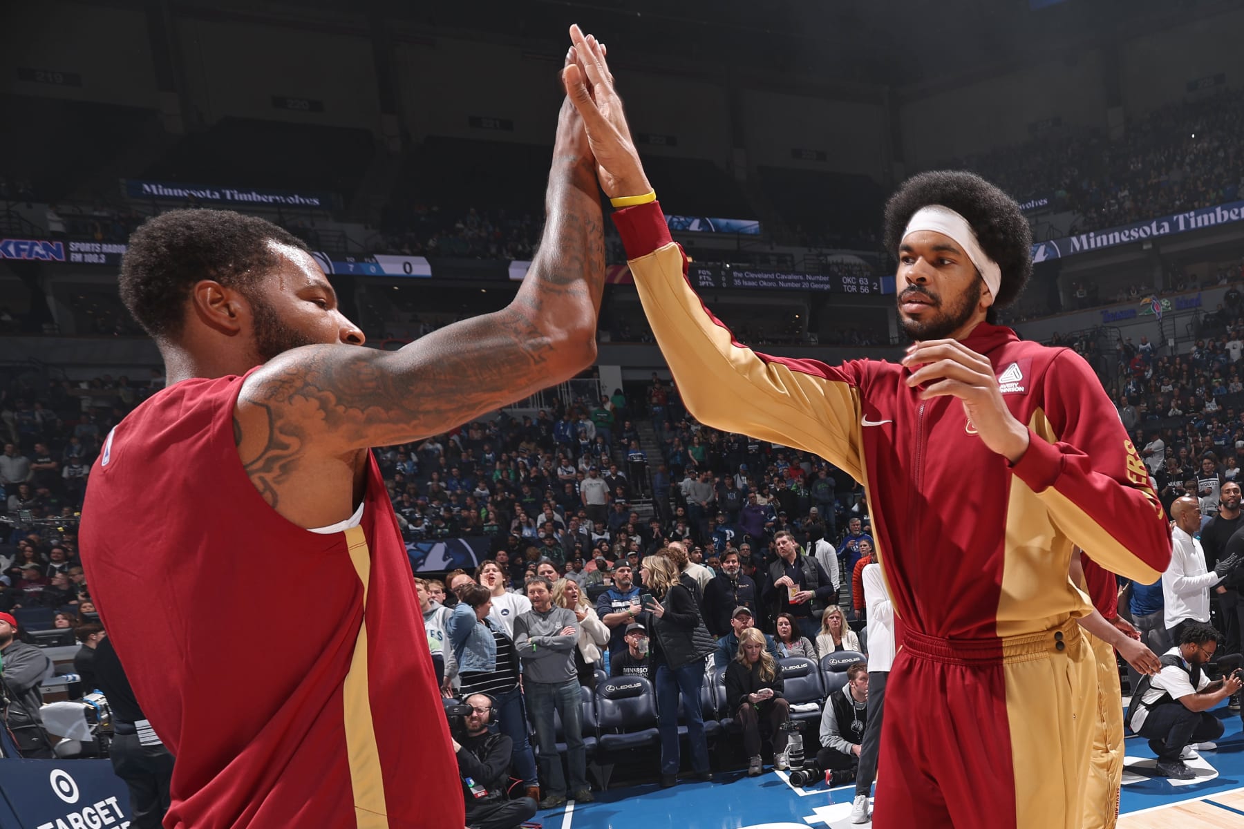 MINNEAPOLIS, MN -  MARCH 22: Jarrett Allen #31 of the Cleveland Cavaliers high fives Marcus Morris Sr. #24 before the game against the Minnesota Timberwolves on March 22, 2024 at Target Center in Minneapolis, Minnesota. NOTE TO USER: User expressly acknowledges and agrees that, by downloading and or using this Photograph, user is consenting to the terms and conditions of the Getty Images License Agreement. Mandatory Copyright Notice: Copyright 2024 NBAE (Photo by David Sherman/NBAE via Getty Images)