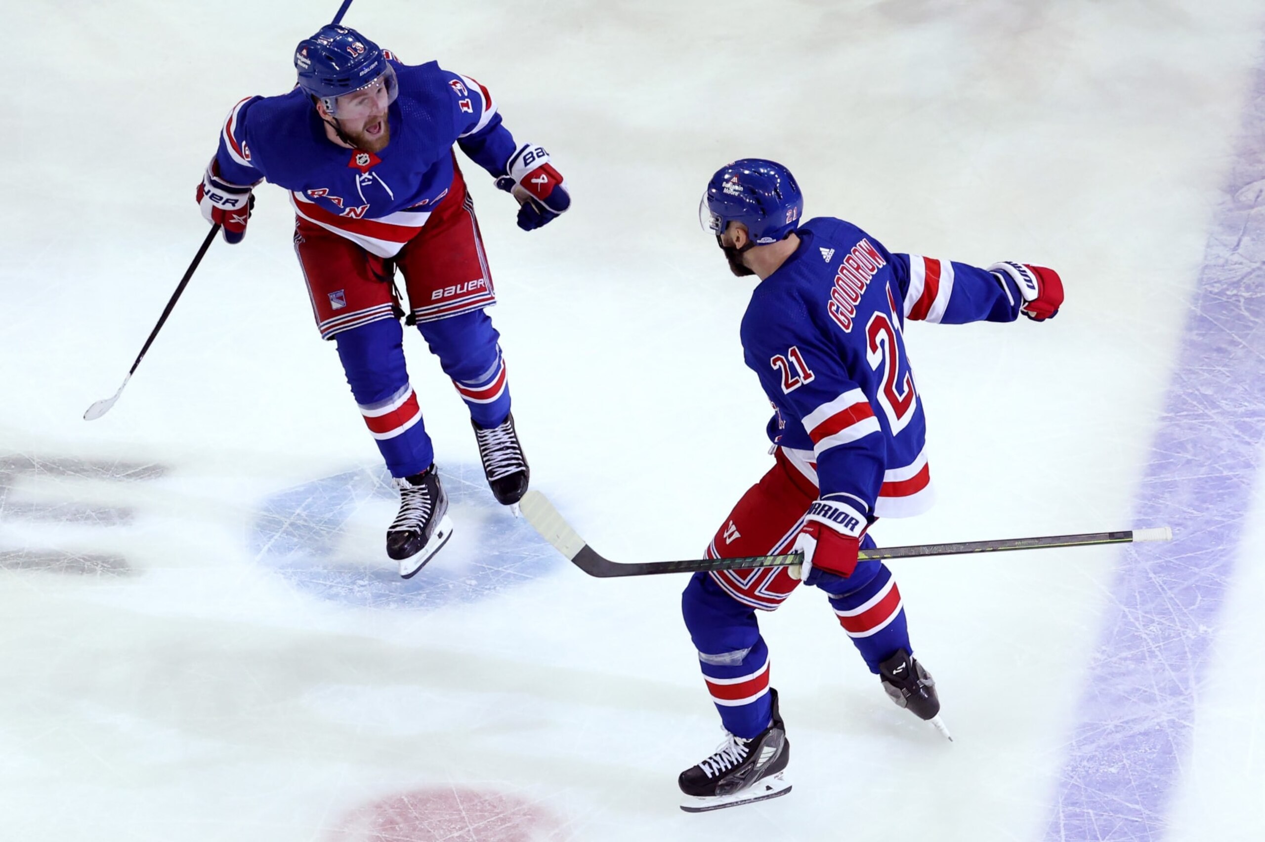 NEW YORK, NEW YORK - MAY 24: Barclay Goodrow #21 and Alexis Lafreniere #13 of the New York Rangers celebrate a goal to win during overtime against the Florida Panthers in Game Two of the Eastern Conference Final of the 2024 Stanley Cup Playoffs at Madison Square Garden on May 24, 2024 in New York City.  (Photo by Elsa/Getty Images)