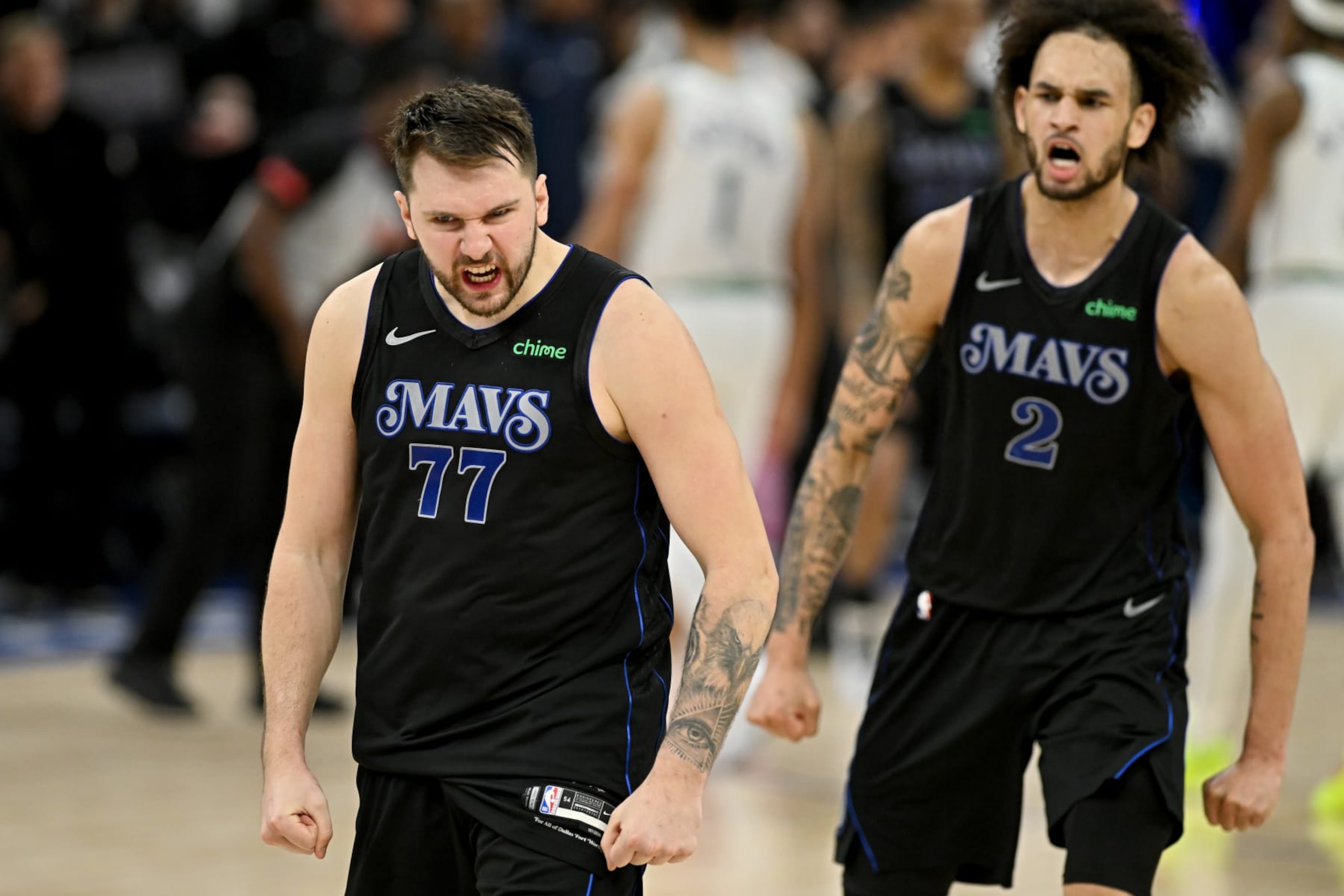 MINNEAPOLIS, MINNESOTA - MAY 24: Luka Doncic #77 and Dereck Lively II #2 of the Dallas Mavericks celebrate after defeating the Minnesota Timberwolves in Game Two of the Western Conference Finals at Target Center on May 24, 2024 in Minneapolis, Minnesota. NOTE TO USER: User expressly acknowledges and agrees that, by downloading and or using this photograph, User is consenting to the terms and conditions of the Getty Images License Agreement. (Photo by Stephen Maturen/Getty Images)