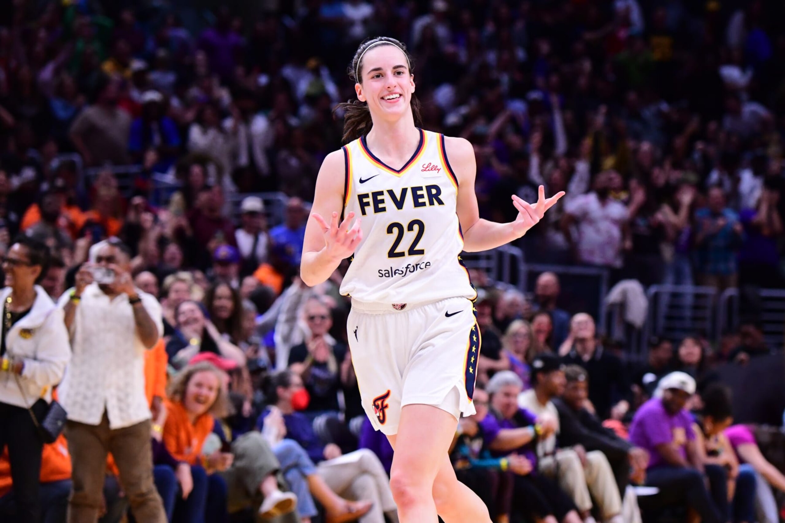 LOS ANGELES, CA - MAY 24: Caitlin Clark #22 of the Indiana Fever celebrates during the game against the Los Angeles Sparks on May 24, 2024 at Crypto.com Arena in Los Angeles, California. NOTE TO USER: User expressly acknowledges and agrees that, by downloading and/or using this Photograph, user is consenting to the terms and conditions of the Getty Images License Agreement. Mandatory Copyright Notice: Copyright 2024 NBAE (Photo by Adam Pantozzi/NBAE via Getty Images)