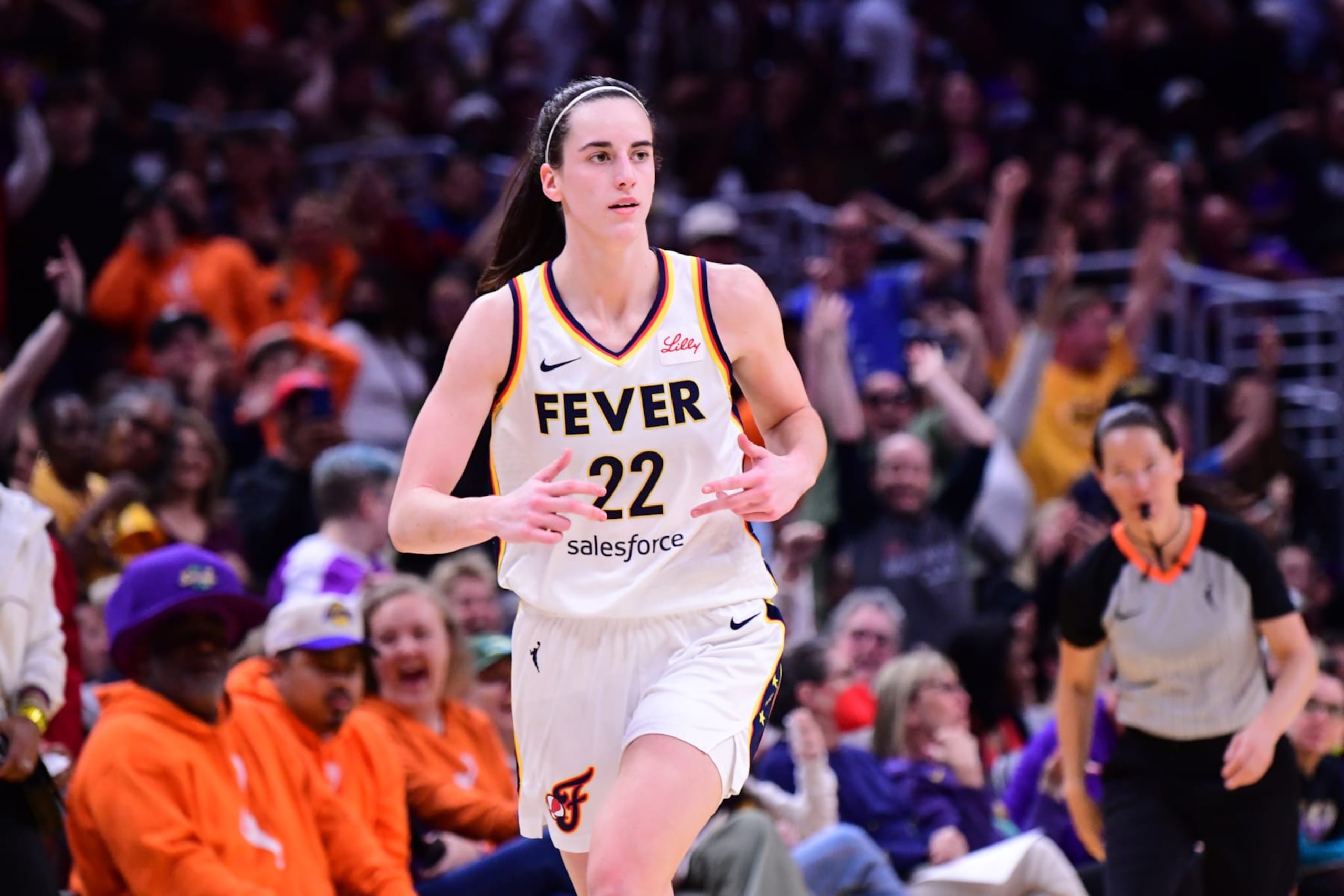 LOS ANGELES, CA - MAY 24: Caitlin Clark #22 of the Indiana Fever celebrates during the game against the Los Angeles Sparks on May 24, 2024 at Crypto.com Arena in Los Angeles, California. NOTE TO USER: User expressly acknowledges and agrees that, by downloading and/or using this Photograph, user is consenting to the terms and conditions of the Getty Images License Agreement. Mandatory Copyright Notice: Copyright 2024 NBAE (Photo by Adam Pantozzi/NBAE via Getty Images)