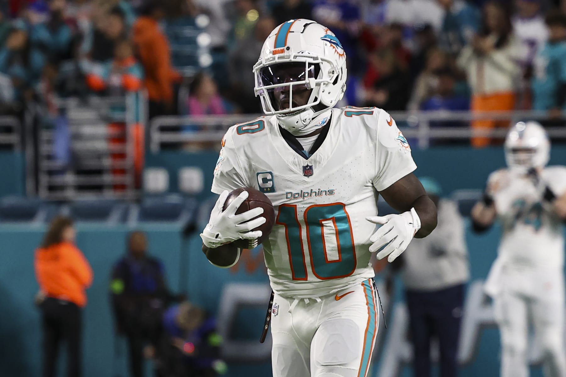 MIAMI GARDENS, FL - JANUARY 07: Tyreek Hill #10 of the Miami Dolphins warms up prior to an NFL football game against the Buffalo Bills at Hard Rock Stadium on January 7, 2024 in Miami Gardens, Florida. (Photo by Perry Knotts/Getty Images)