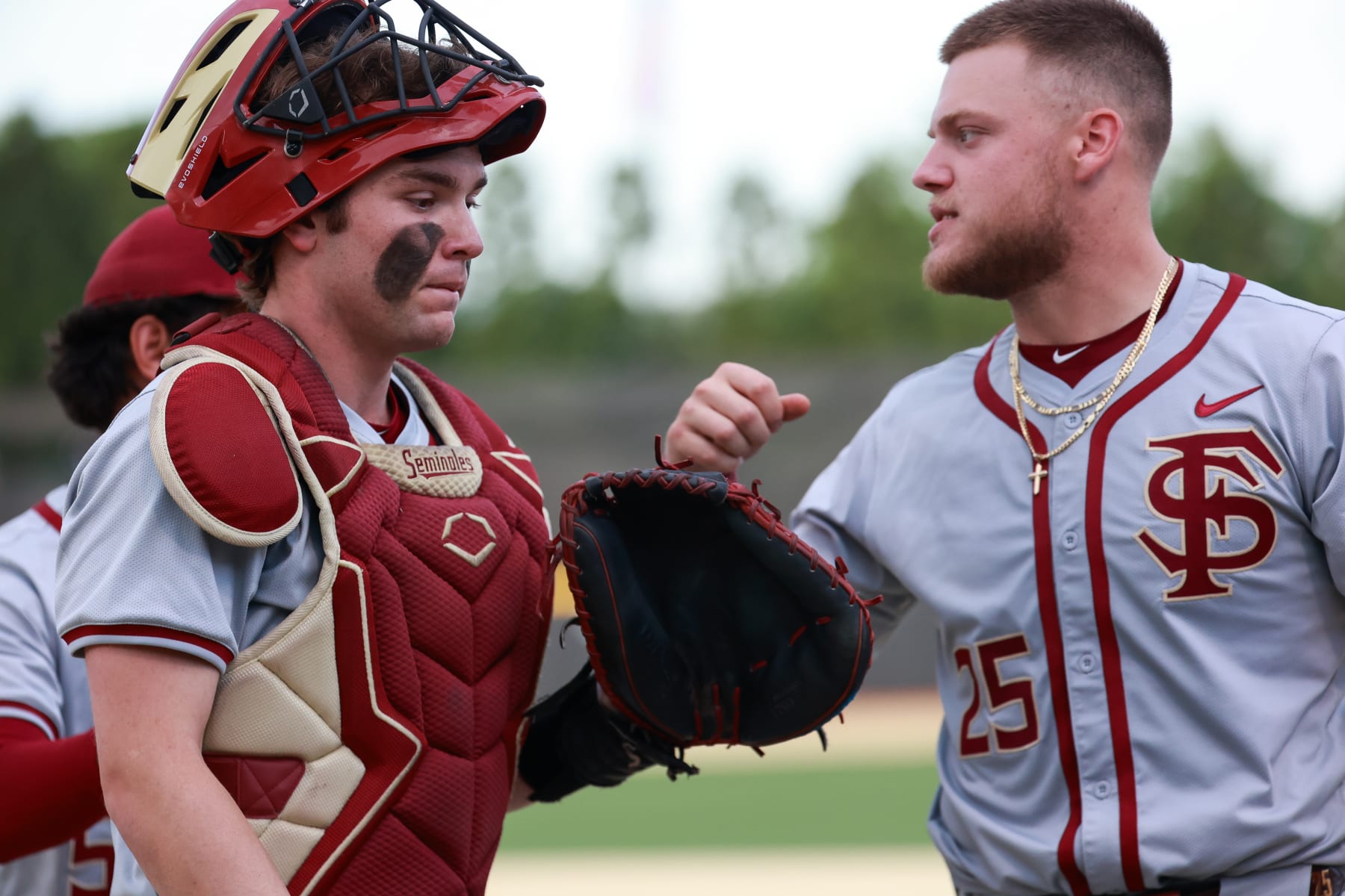 WINSTON SALEM, NORTH CAROLINA - APRIL 19: Jaxson West #20 of the Florida State Seminoles taps McGwire Holbrook #25 of the Florida State Seminoles after an inning against the Wake Forest Demon Deacons at David F. Couch Ballpark on April 19, 2024 in Winston Salem, North Carolina. (Photo by Isaiah Vazquez/Getty Images)