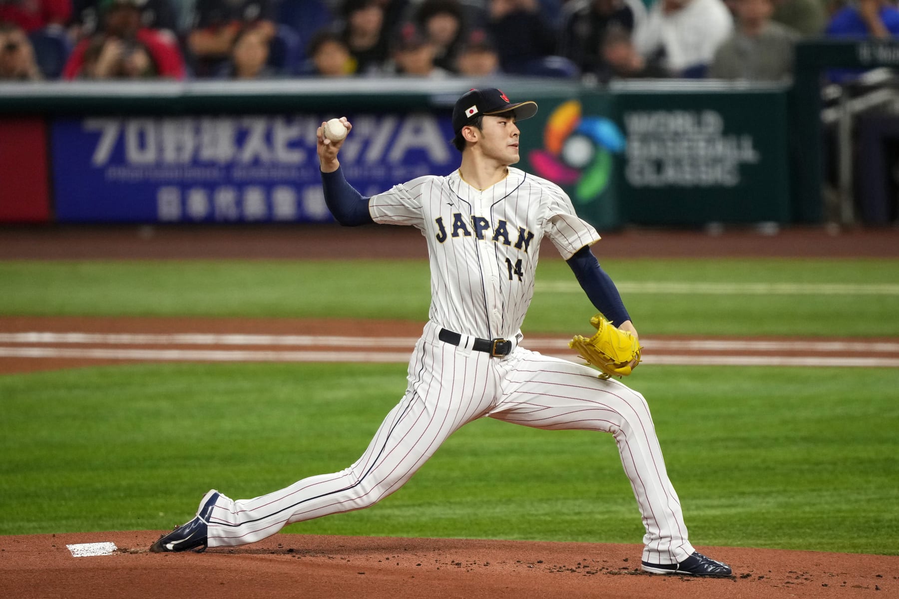 MIAMI, FL - MARCH 20: Roki Sasaki #14 of Japan delivers a pitch in the first inning against Mexico at loanDepot park on March 20, 2023 in Miami, Florida. (Photo by Jasen Vinlove/Miami Marlins/Getty Images)
