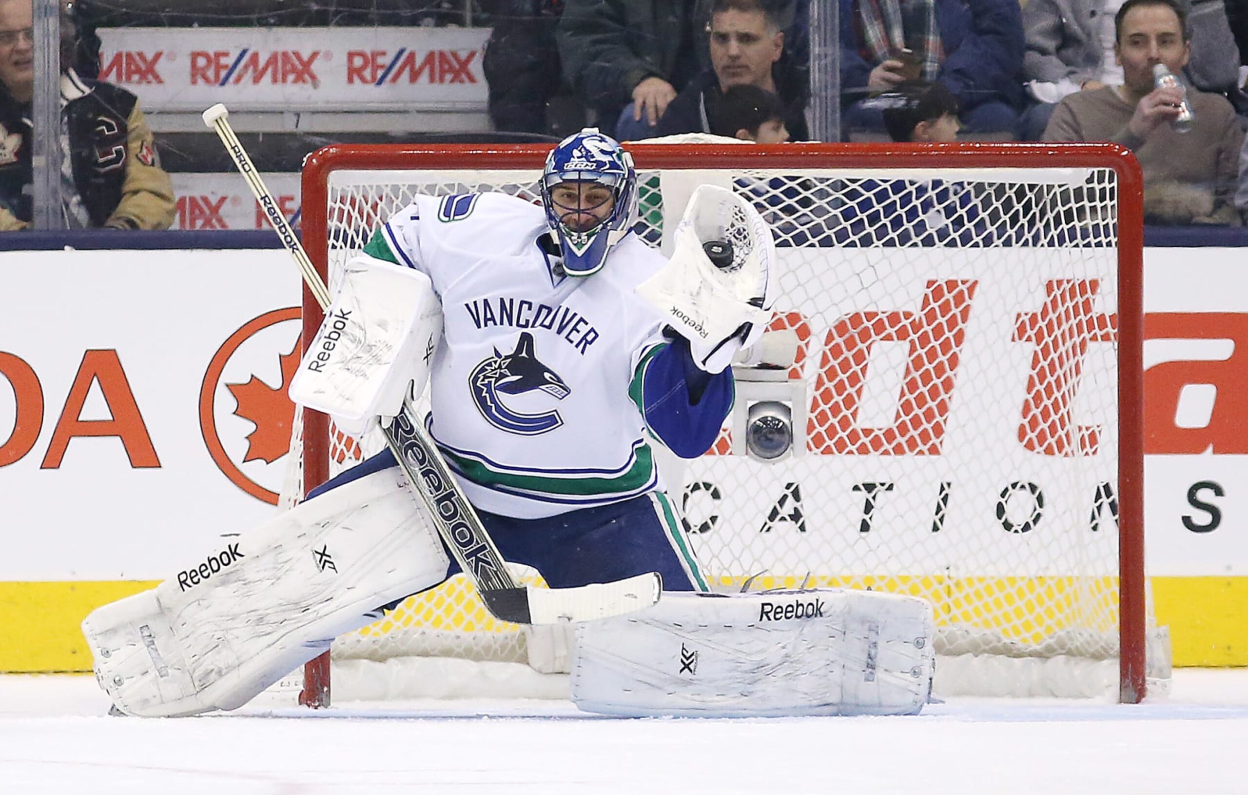 TORONTO, ON- FEBRUARY 8 -  Roberto Luongo makes a glove save as the Toronto Maple Leafs play the Vancouver Canucks  at  Air Canada Centre In Toronto. February 8, 2014.        (Steve Russell/Toronto Star via Getty Images)