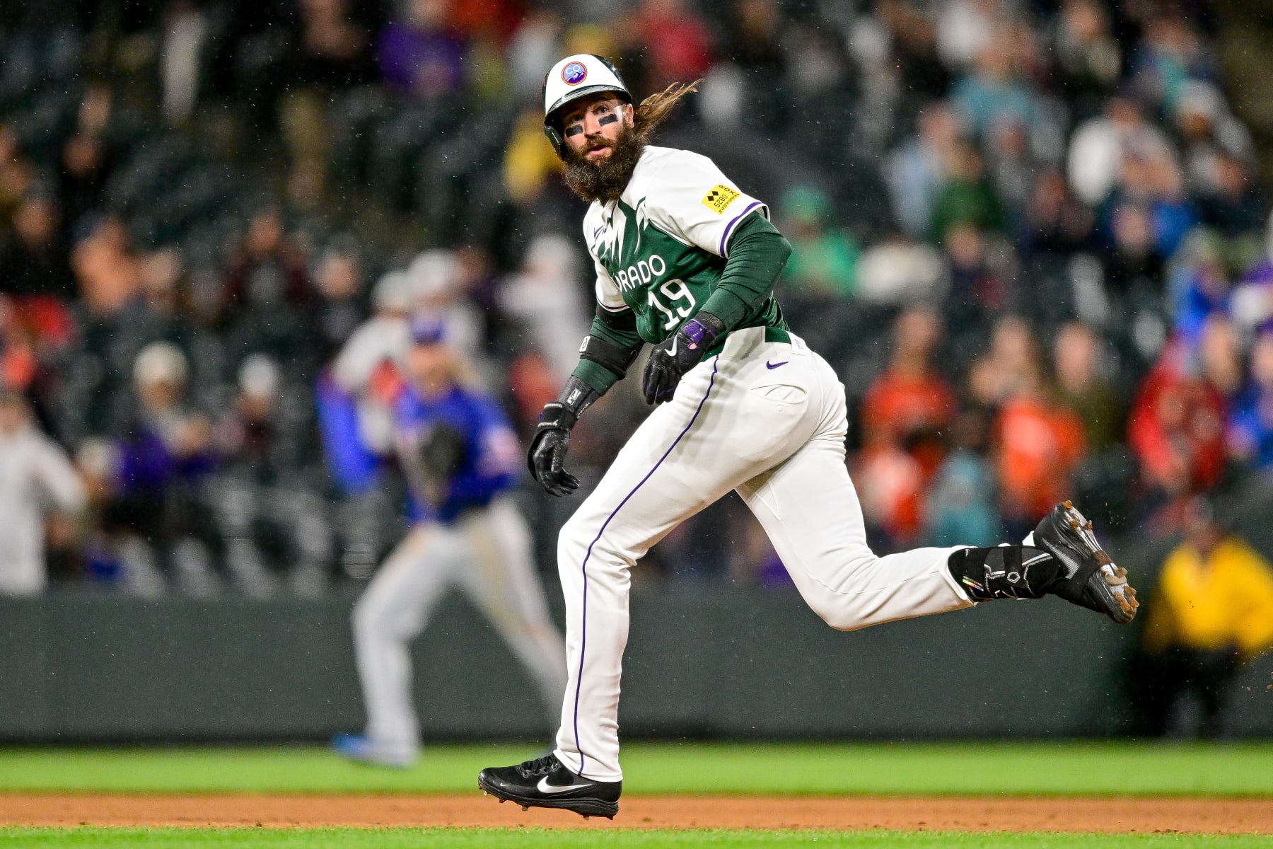 DENVER, COLORADO - MAY 11: Charlie Blackmon #19 of the Colorado Rockies advances to third base after a double and fielding error in the seventh inning against the Texas Rangers at Coors Field on May 11, 2024 in Denver, Colorado. (Photo by Dustin Bradford/Getty Images)