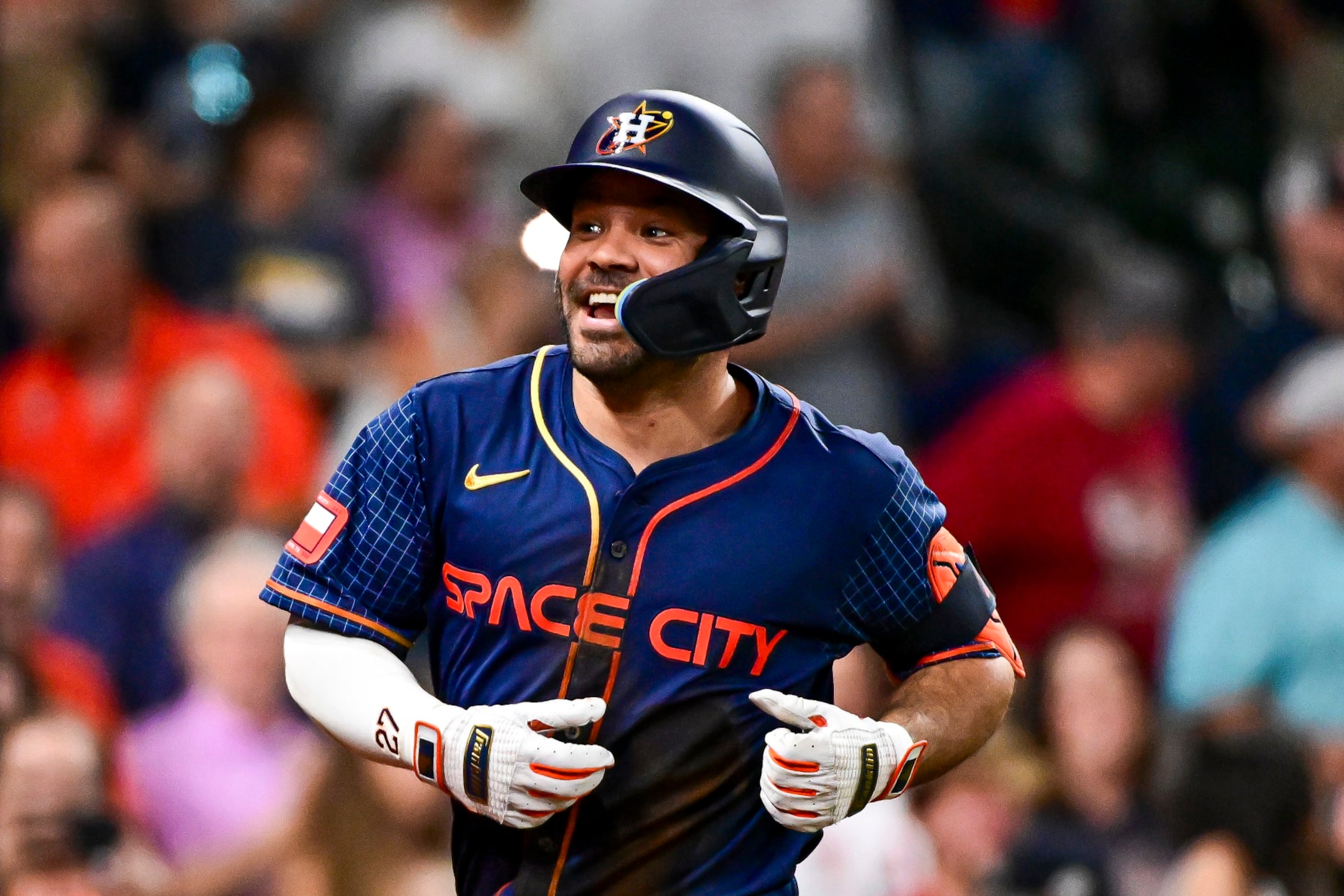 HOUSTON, TEXAS - MAY 20: Jose Altuve #27 of the Houston Astros celebrates after scoring a three-run home run in the second inning against the Los Angeles Angels at Minute Maid Park on May 20, 2024 in Houston, Texas. (Photo by Logan Riely/Getty Images)