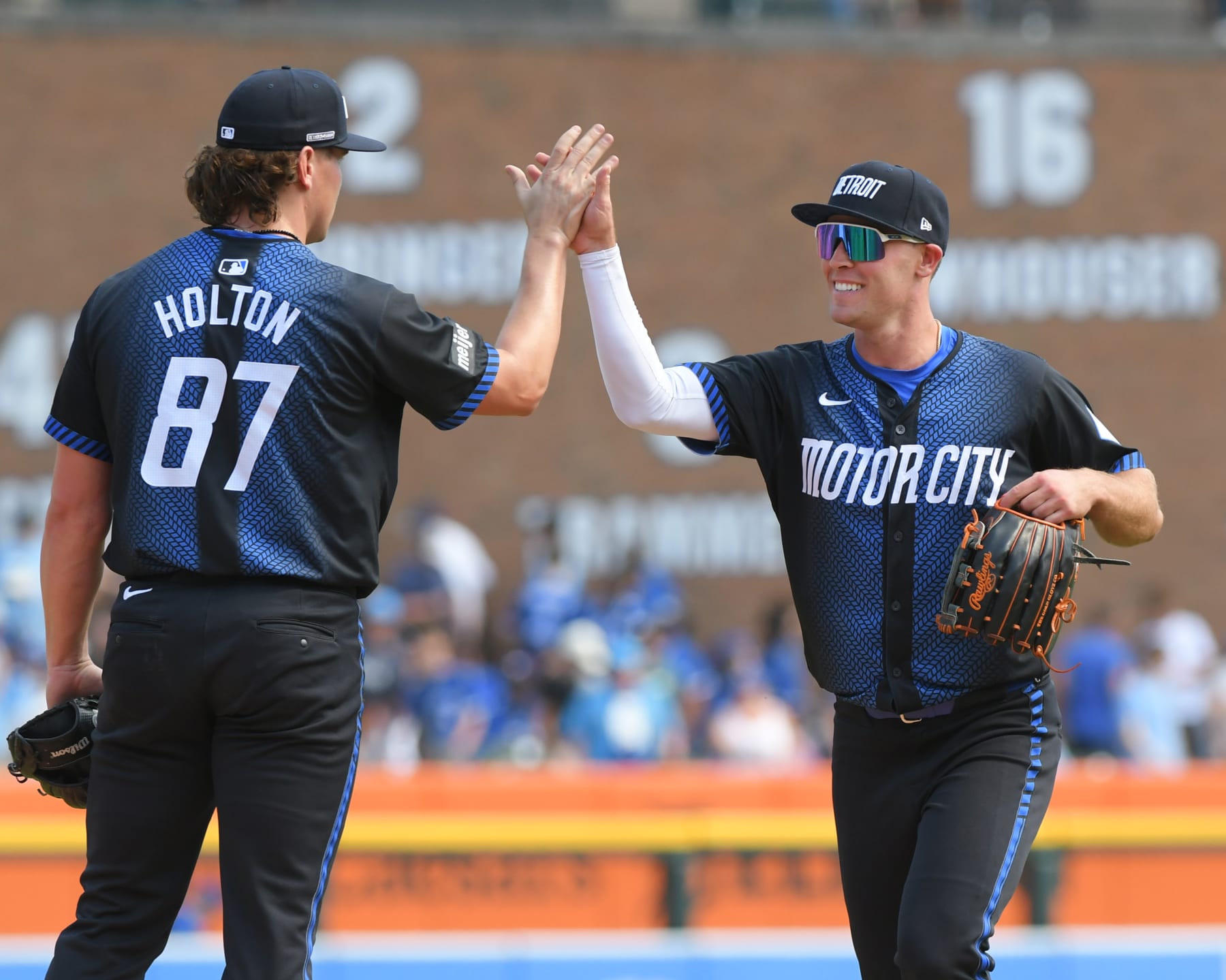 DETROIT, MI - MAY 25:  Tyler Holton #87 and Kerry Carpenter #30 of the Detroit Tigers high-five to celebrate the victory against the Toronto Blue Jays while wearing the new Motor City City Connect uniform at Comerica Park on May 25, 2024 in Detroit, Michigan. The Tigers defeated the Blue Jays 2-1.  (Photo by Mark Cunningham/MLB Photos via Getty Images)
