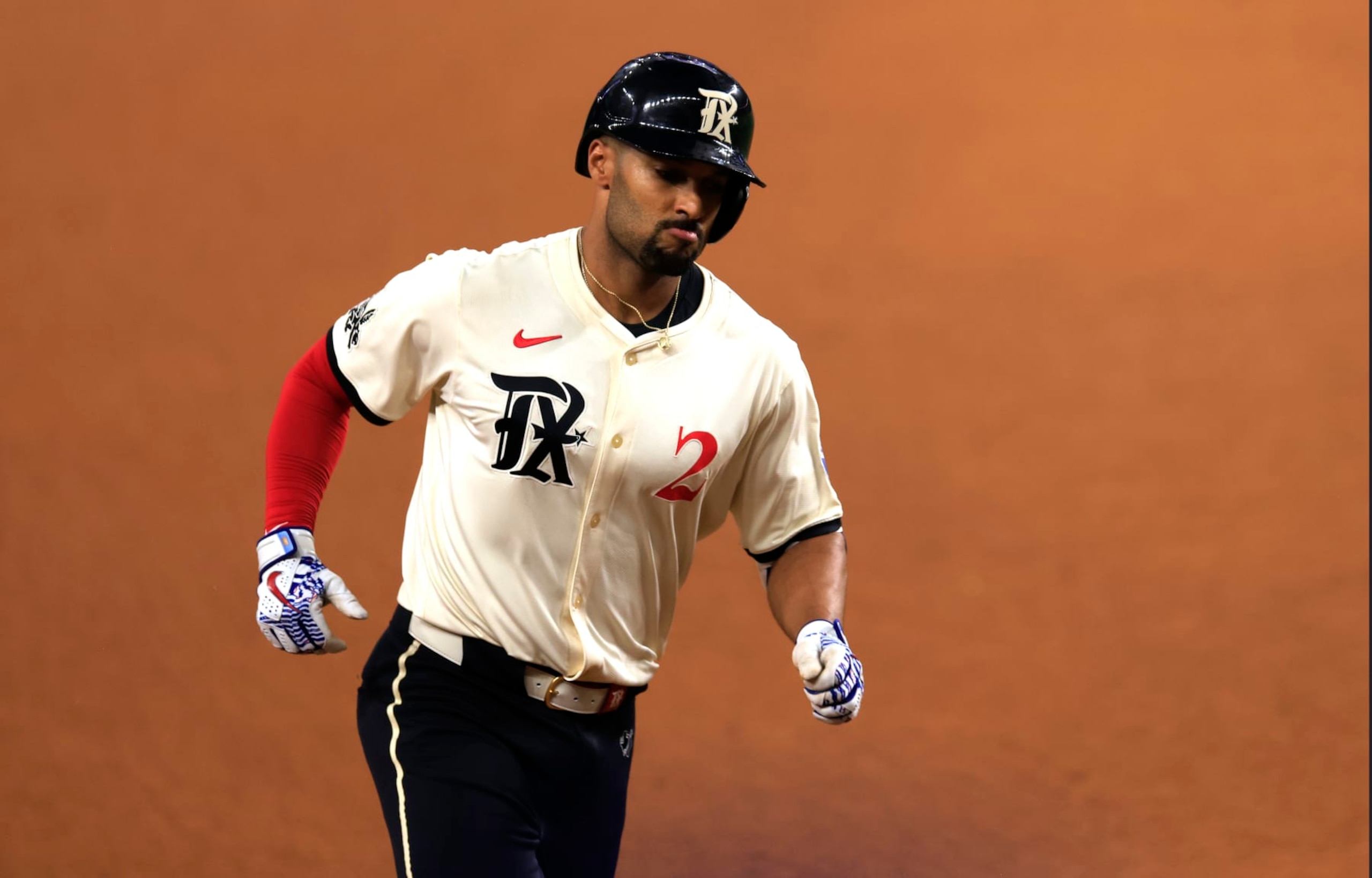 ARLINGTON, TX - APRIL 26: Marcus Semien #2 of the Texas Rangers rounds the bases after hitting a solo go ahead home run against the Cincinnati Reds during the eighth inning at Globe Life Field on April 26, 2024 in Arlington, Texas. (Photo by Ron Jenkins/Getty Images)