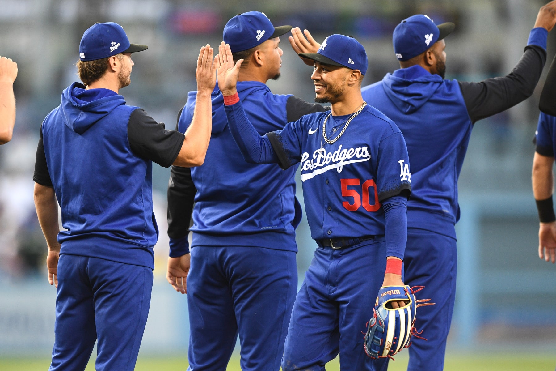 LOS ANGELES, CA - JULY 23: Los Angeles Dodgers right fielder Mookie Betts (50) gets a high five after the MLB game between the San Francisco Giants and the Los Angeles Dodgers on July 23, 2022 at Dodger Stadium in Los Angeles, CA. (Photo by Brian Rothmuller/Icon Sportswire via Getty Images)
