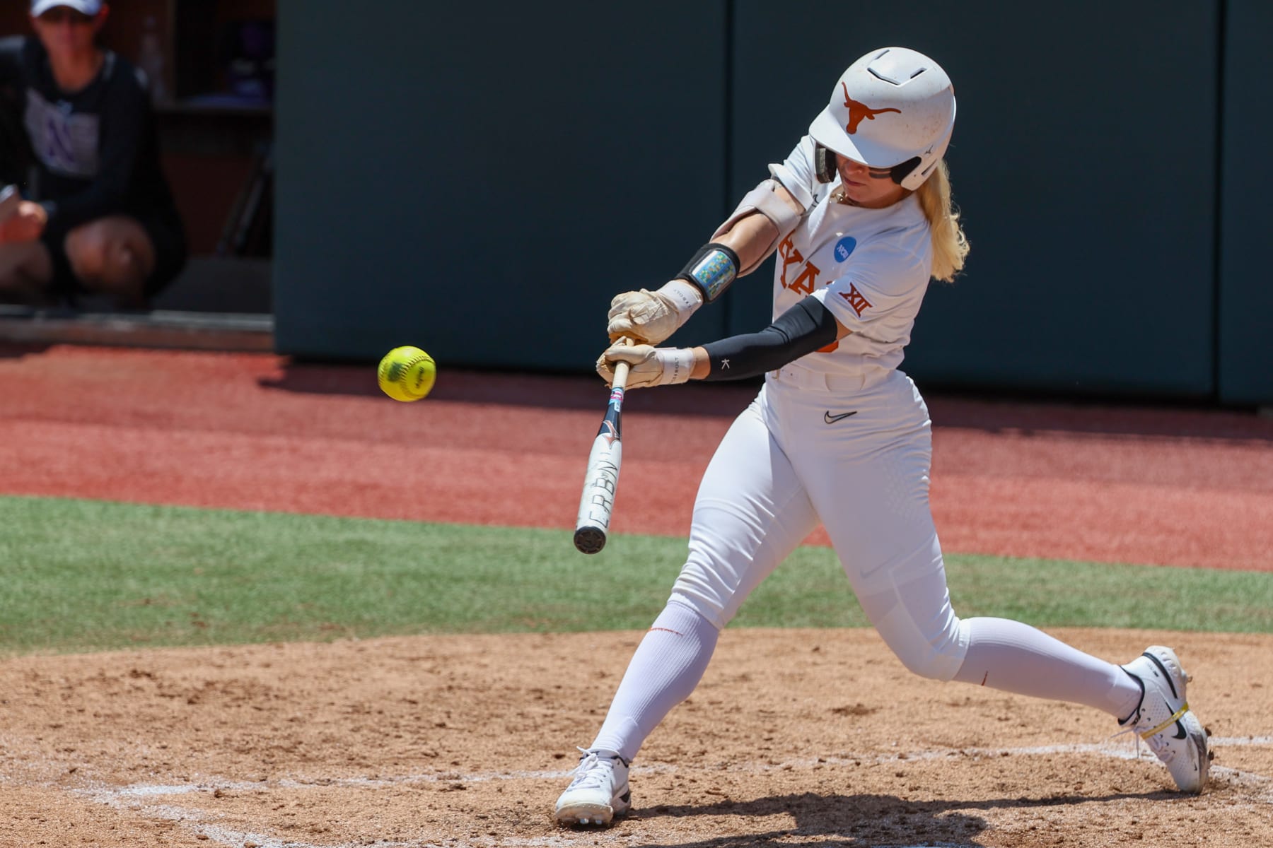 AUSTIN, TX - MAY 18: Texas outfielder Bella Dayton (6) hits the ball during the NCAA Division I Regional game between Texas Longhorns and Northwestern Wildcats on May 18, 2024, at Red & Charline McCombs Field in Austin, TX. (Photo by David Buono/Icon Sportswire via Getty Images)