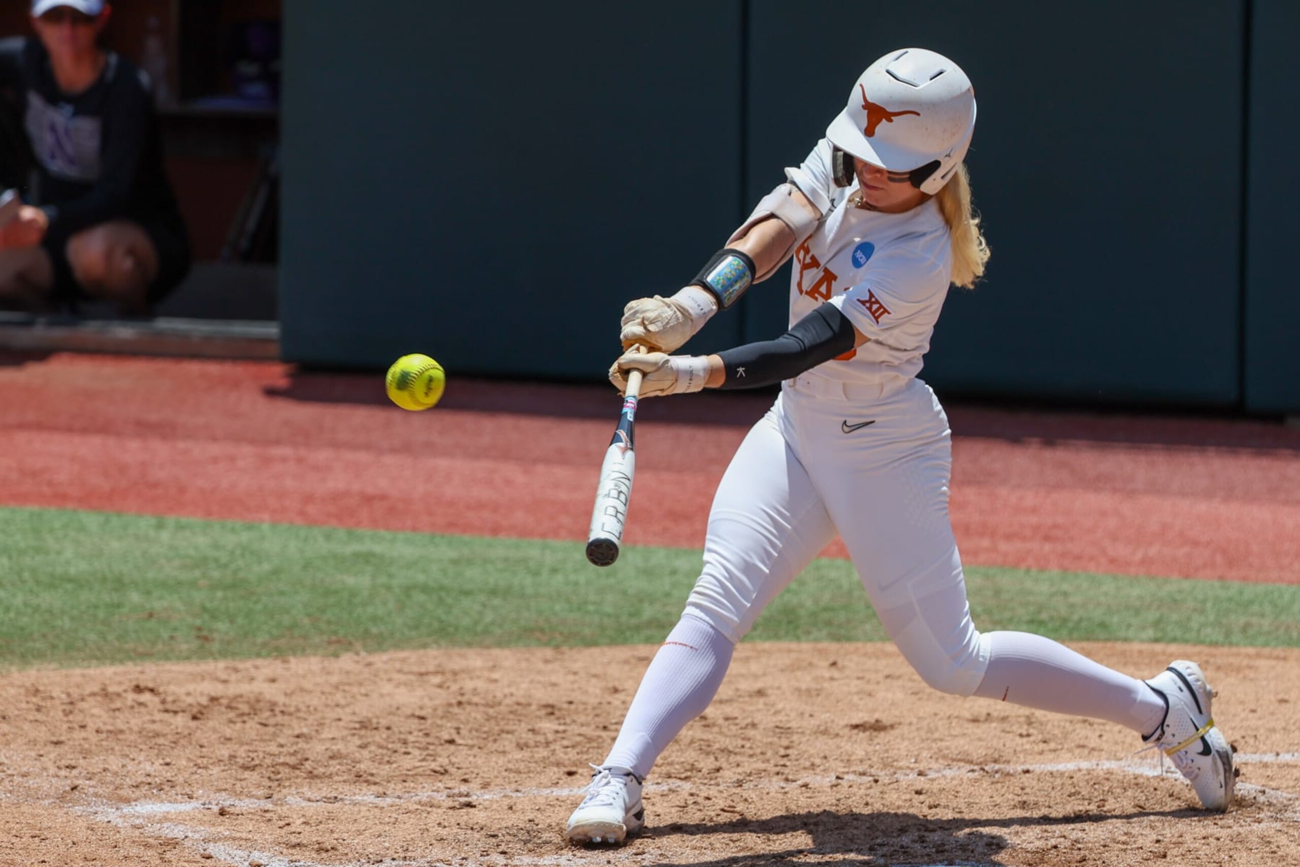 AUSTIN, TX - MAY 18: Texas outfielder Bella Dayton (6) hits the ball during the NCAA Division I Regional game between Texas Longhorns and Northwestern Wildcats on May 18, 2024, at Red & Charline McCombs Field in Austin, TX. (Photo by David Buono/Icon Sportswire via Getty Images)