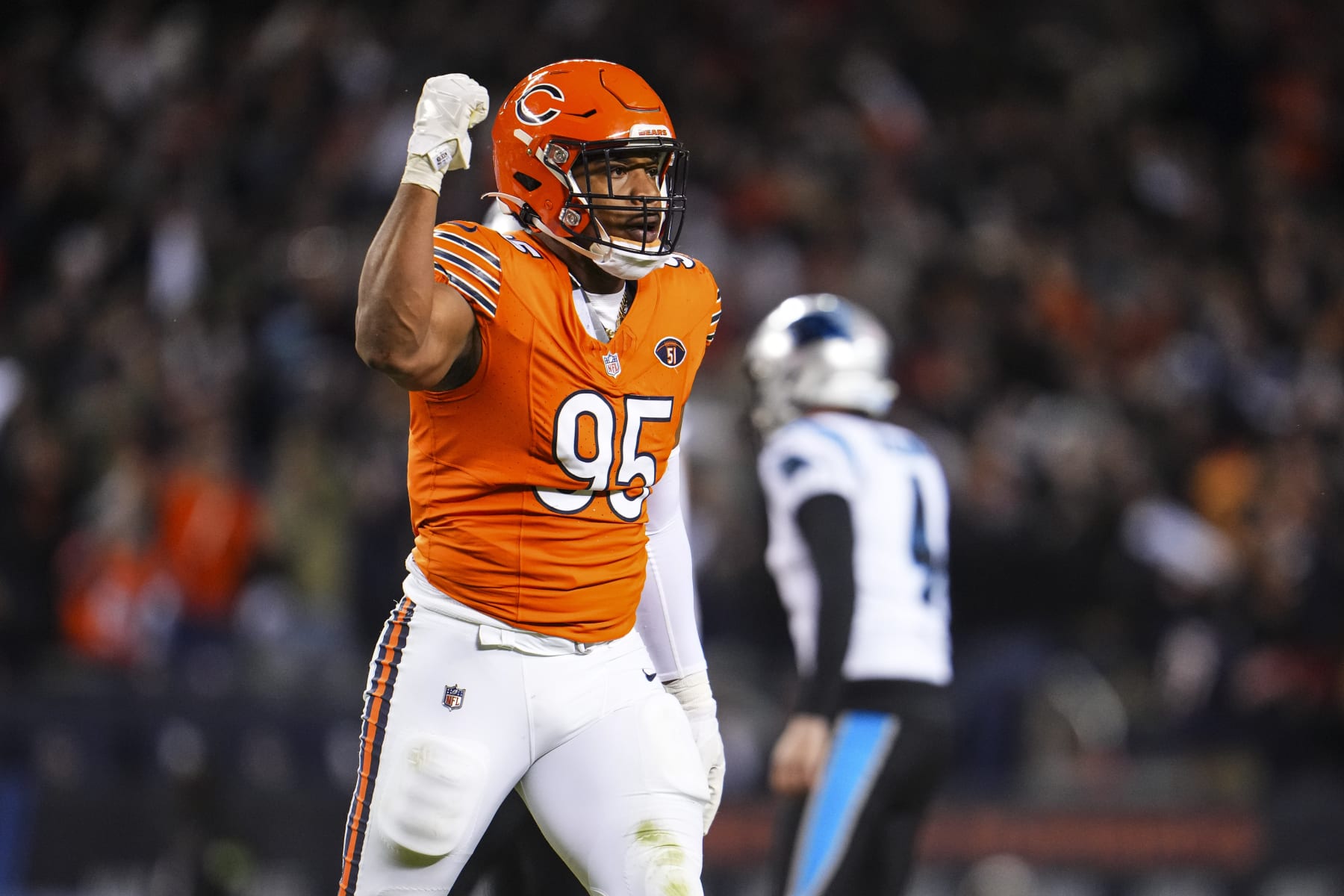 CHICAGO, IL - NOVEMBER 09: DeMarcus Walker #95 of the Chicago Bears celebrates during an NFL football game against the Carolina Panthers at Soldier Field on November 9, 2023 in Chicago, Illinois. (Photo by Cooper Neill/Getty Images)