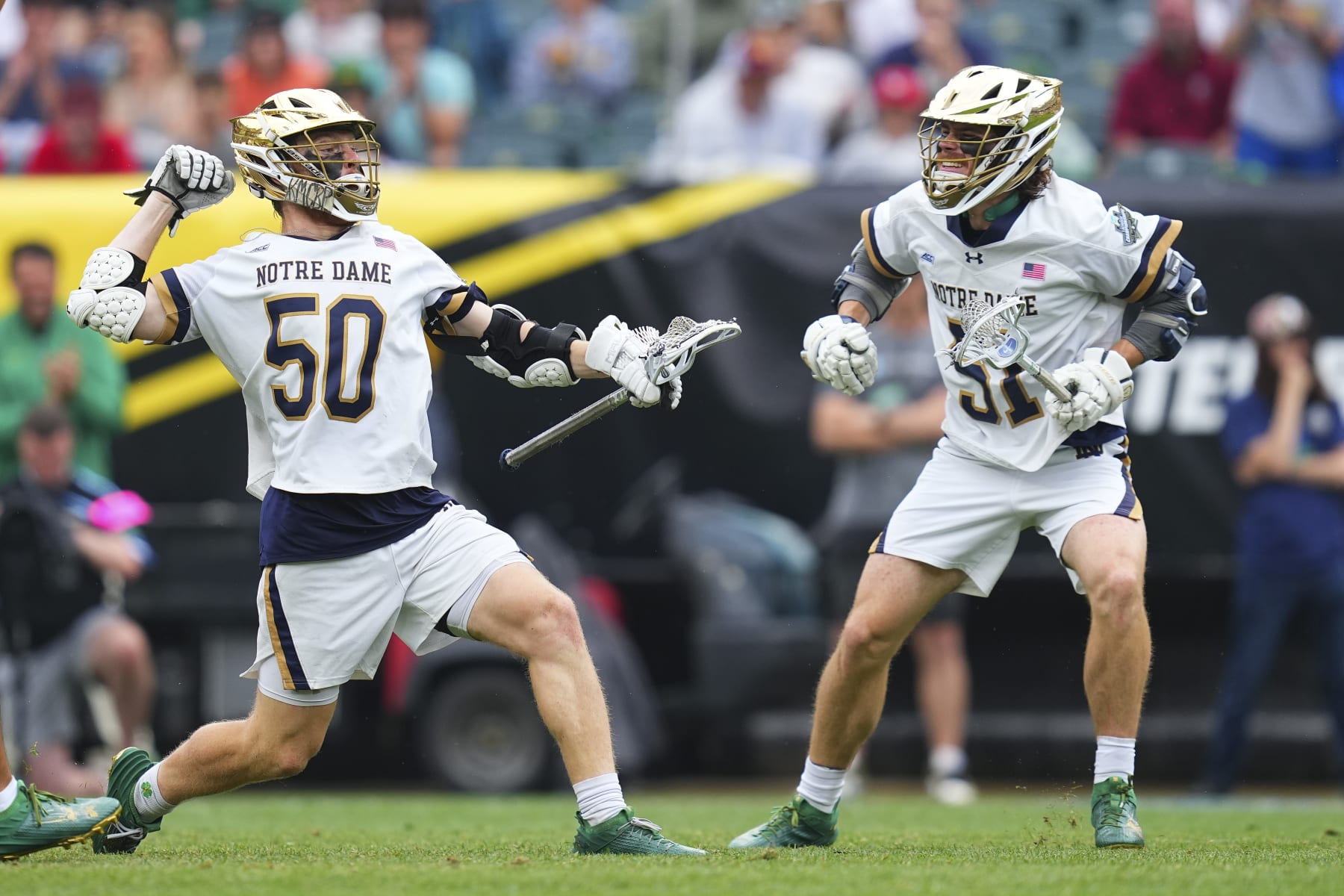 PHILADELPHIA, PENNSYLVANIA - MAY 27: Chris Kavanagh #50 of the Notre Dame Fighting Irish celebrates his goal along with Pat Kavanagh #51 against the Maryland Terrapins in the first half of the NCAA Division I Mens Lacrosse Championship game at Lincoln Financial Field on May 27, 2024 in Philadelphia, Pennsylvania.  (Photo by Mitchell Leff/Getty Images)
