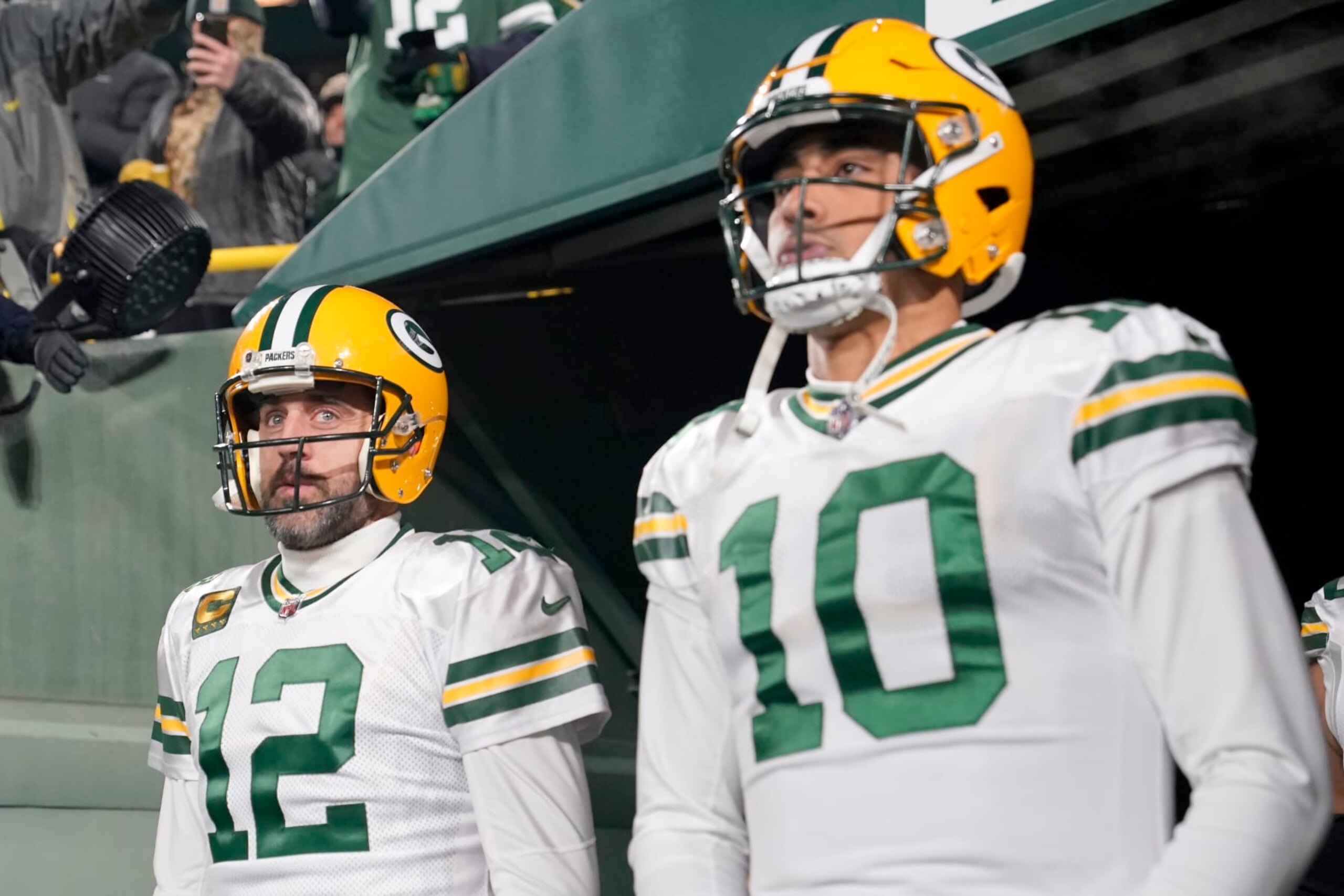 GREEN BAY, WISCONSIN - NOVEMBER 17: Aaron Rodgers #12 and Jordan Love #10 of the Green Bay Packers look on prior to the game against the Tennessee Titans at Lambeau Field on November 17, 2022 in Green Bay, Wisconsin. (Photo by Patrick McDermott/Getty Images)