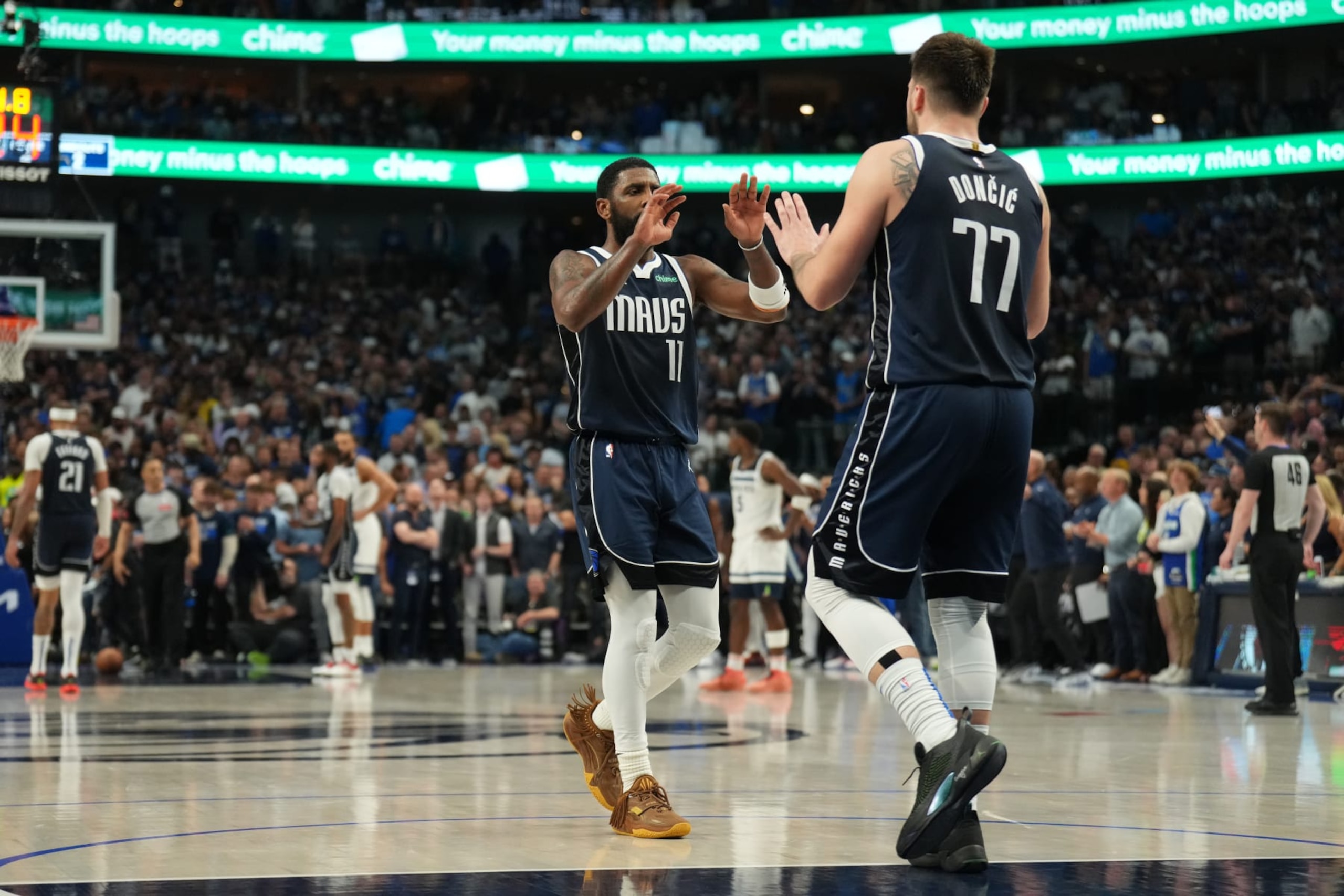 DALLAS, TX - MAY 26: Kyrie Irving #11 and Luka Doncic #77 of the Dallas Mavericks celebrate after the game against the Minnesota Timberwolves during Game 3 of the Western Conference Finals of the 2024 NBA Playoffs on May 26, 2024 at the American Airlines Center in Dallas, Texas. NOTE TO USER: User expressly acknowledges and agrees that, by downloading and or using this photograph, User is consenting to the terms and conditions of the Getty Images License Agreement. Mandatory Copyright Notice: Copyright 2024 NBAE (Photo by Jesse D. Garrabrant/NBAE via Getty Images)