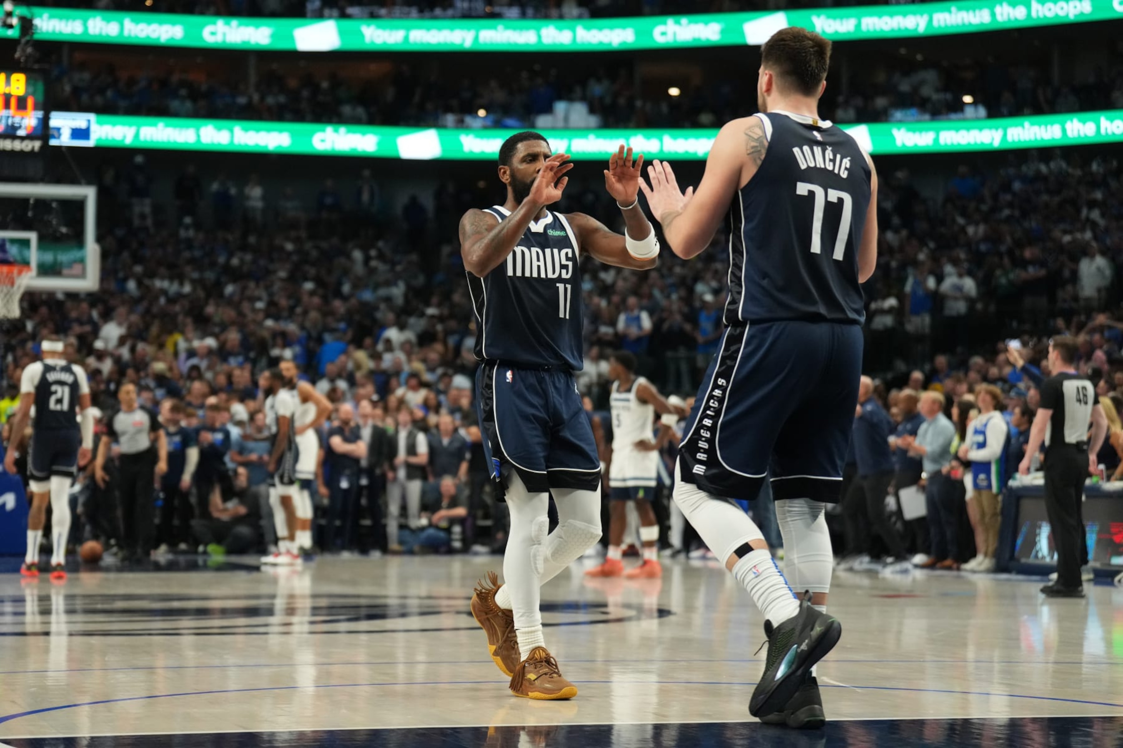 DALLAS, TX - MAY 26: Kyrie Irving #11 and Luka Doncic #77 of the Dallas Mavericks celebrate after the game against the Minnesota Timberwolves during Game 3 of the Western Conference Finals of the 2024 NBA Playoffs on May 26, 2024 at the American Airlines Center in Dallas, Texas. NOTE TO USER: User expressly acknowledges and agrees that, by downloading and or using this photograph, User is consenting to the terms and conditions of the Getty Images License Agreement. Mandatory Copyright Notice: Copyright 2024 NBAE (Photo by Jesse D. Garrabrant/NBAE via Getty Images)