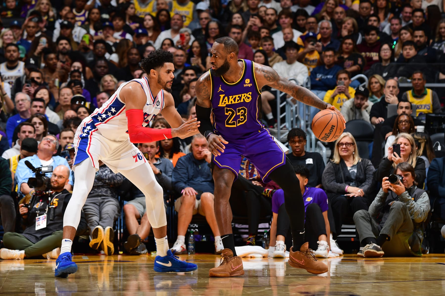 LOS ANGELES, CA - MARCH 22: LeBron James #23 of the Los Angeles Lakers handles the ball during the game against the Philadelphia 76ers on March 22, 2024 at Crypto.Com Arena in Los Angeles, California. NOTE TO USER: User expressly acknowledges and agrees that, by downloading and/or using this Photograph, user is consenting to the terms and conditions of the Getty Images License Agreement. Mandatory Copyright Notice: Copyright 2024 NBAE (Photo by Adam Pantozzi/NBAE via Getty Images)