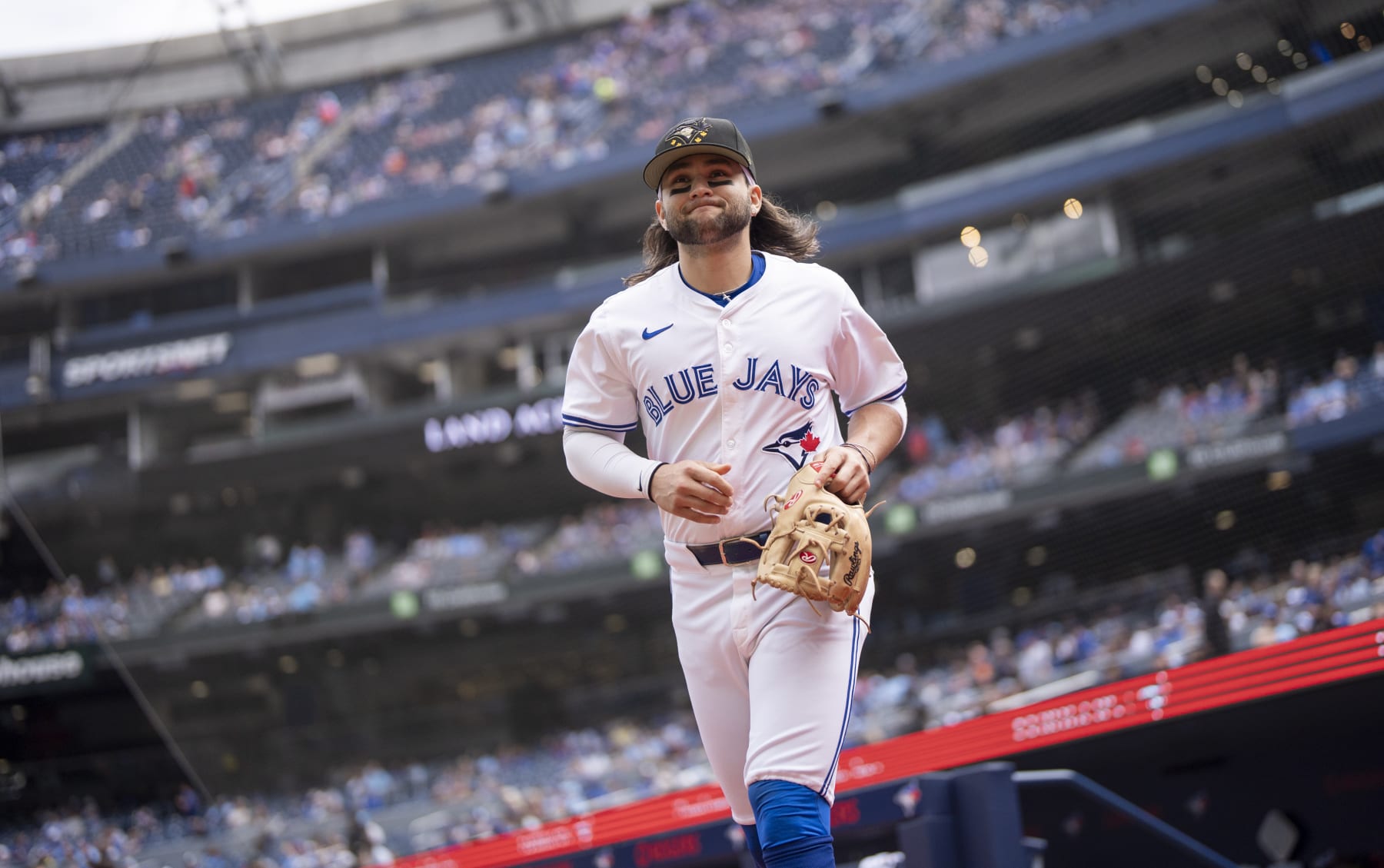 TORONTO, ON - MAY 18: Bo Bichette #11 of Toronto Blue Jays takes the field to warm up ahead of playing the Tampa Bay Rays in their MLB game at the Rogers Centre on May 18, 2024 in Toronto, Ontario, Canada. (Photo by Mark Blinch/Getty Images)